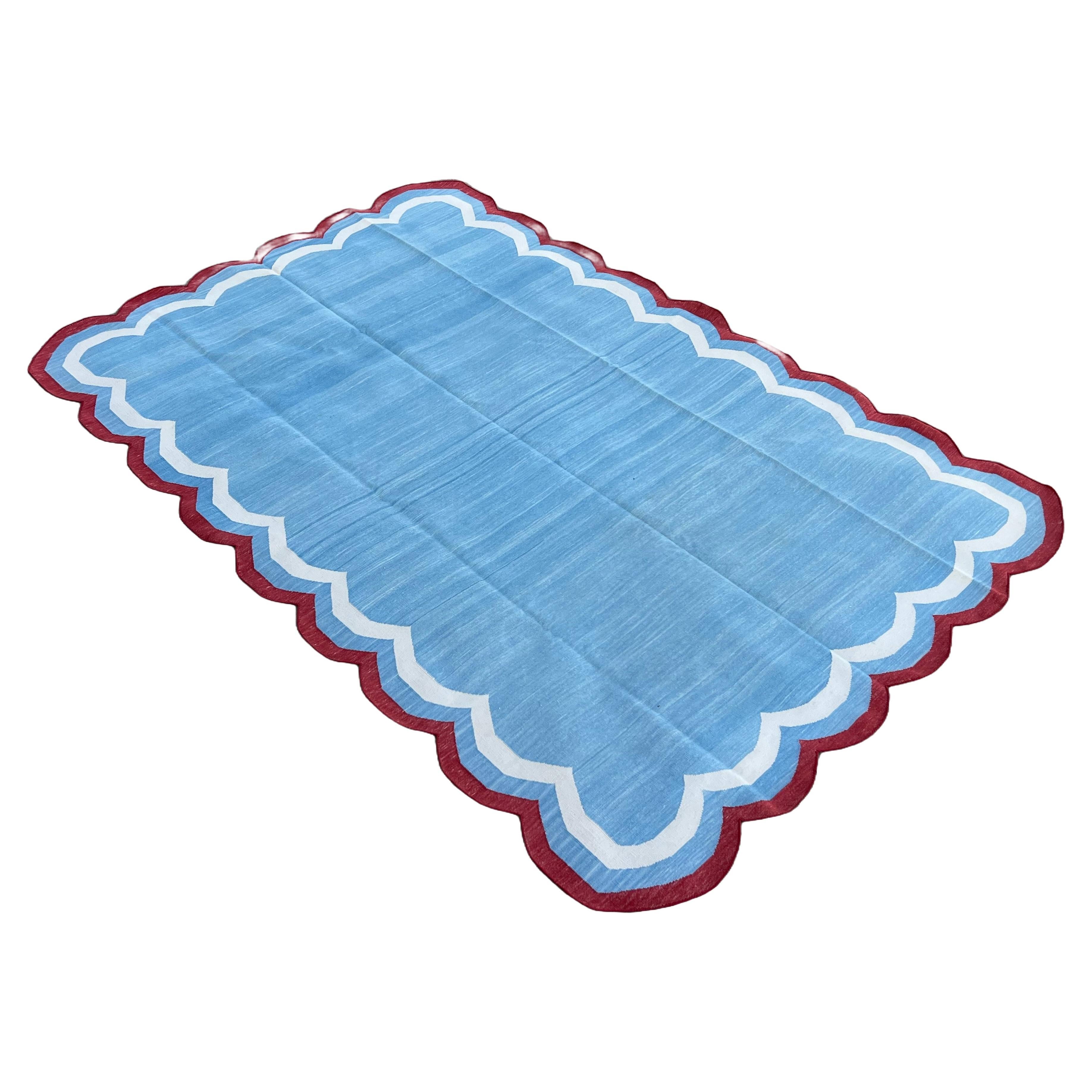 Cotton Vegetable Dyed Sky Blue, Cream And Tomato Red Four Sided Scalloped Rug-6'x9' (Scallops runs on all Four Sides)

These special flat-weave dhurries are hand-woven with 15 ply 100% cotton yarn. Due to the special manufacturing techniques used to