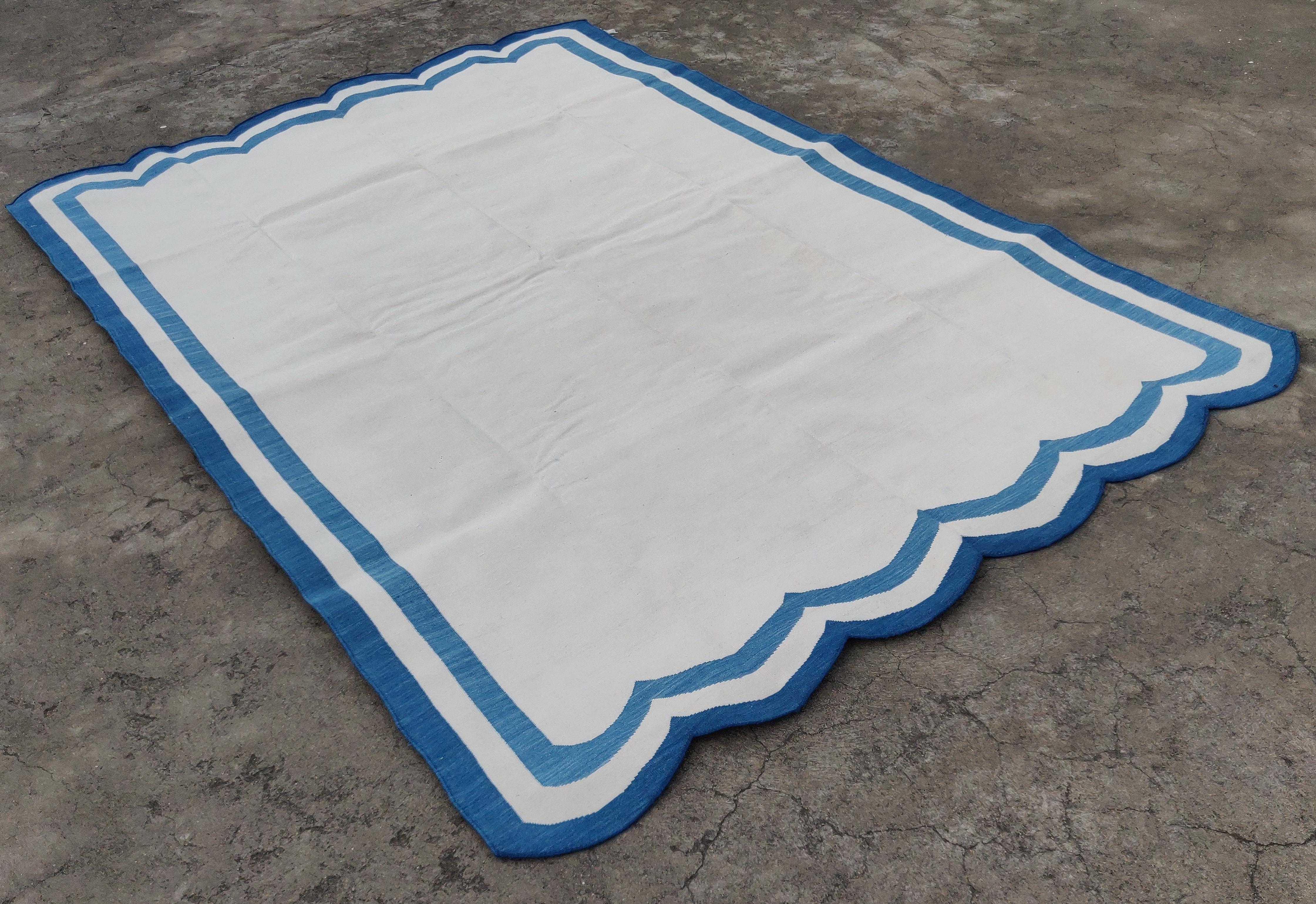 Cotton Vegetable Dyed White And Indigo Blue Two Sided Scalloped Rug-6'x9' 
(Scallops runs on 6 Feet Sides)
These special flat-weave dhurries are hand-woven with 15 ply 100% cotton yarn. Due to the special manufacturing techniques used to create our