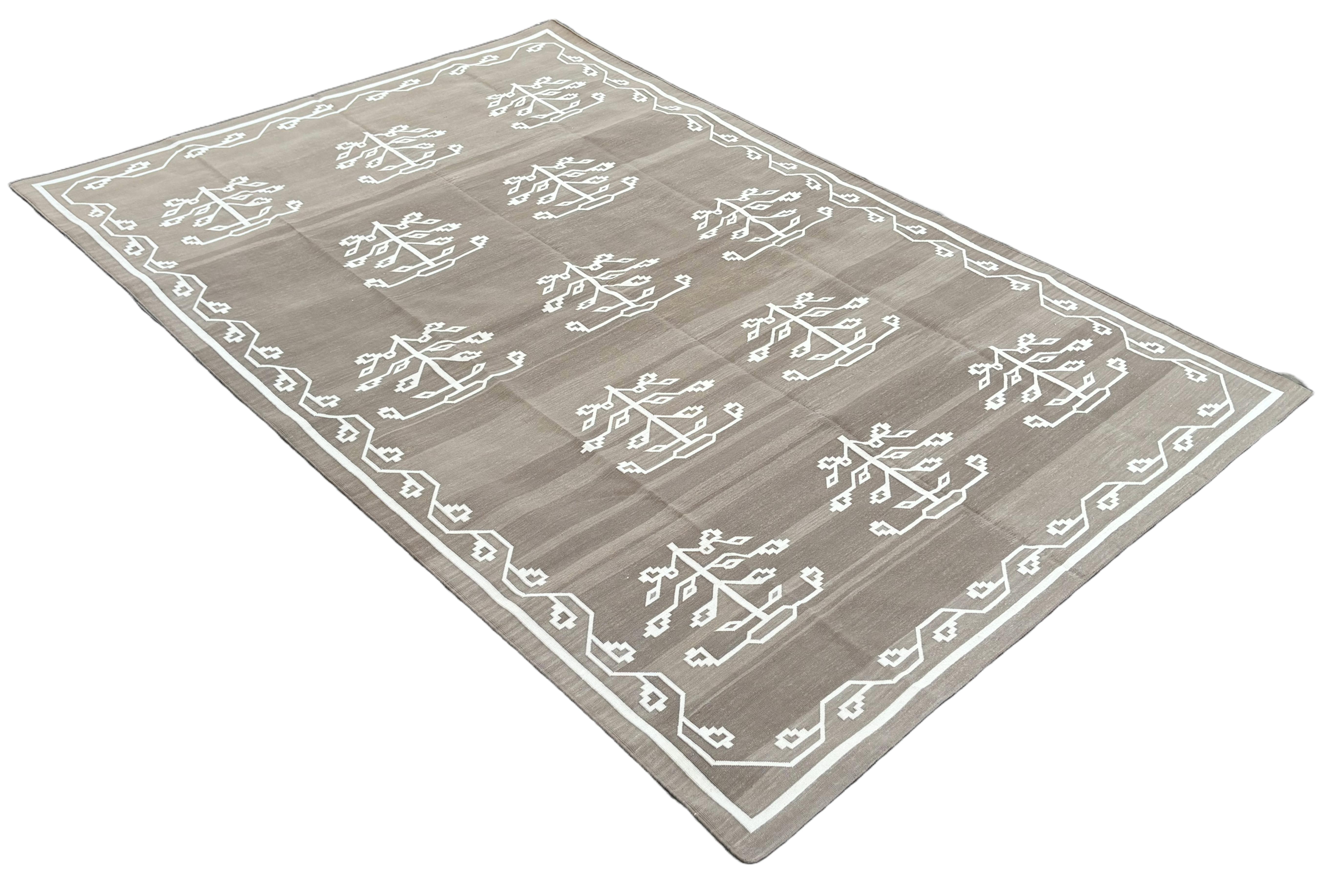 Cotton Vegetable Dyed Beige And White Leaf Pattern Indian Dhurrie Rug-7'x10' 
These special flat-weave dhurries are hand-woven with 15 ply 100% cotton yarn. Due to the special manufacturing techniques used to create our rugs, the size and color of