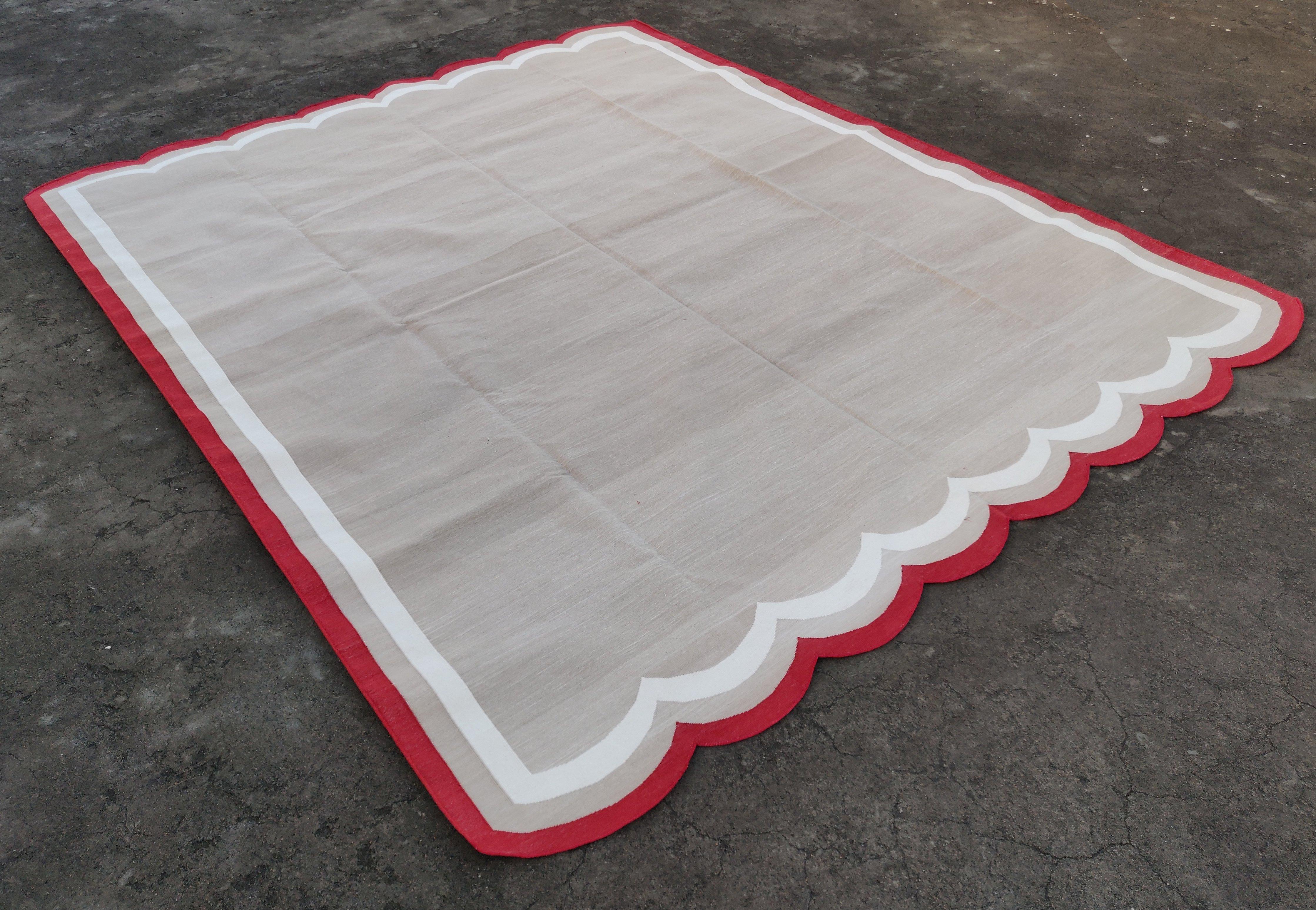 Cotton Vegetable Dyed Cream, Beige And Red Two Sided Scalloped Rug-8'x10' 
(Scallops runs on 6 Feet Sides)
These special flat-weave dhurries are hand-woven with 15 ply 100% cotton yarn. Due to the special manufacturing techniques used to create our