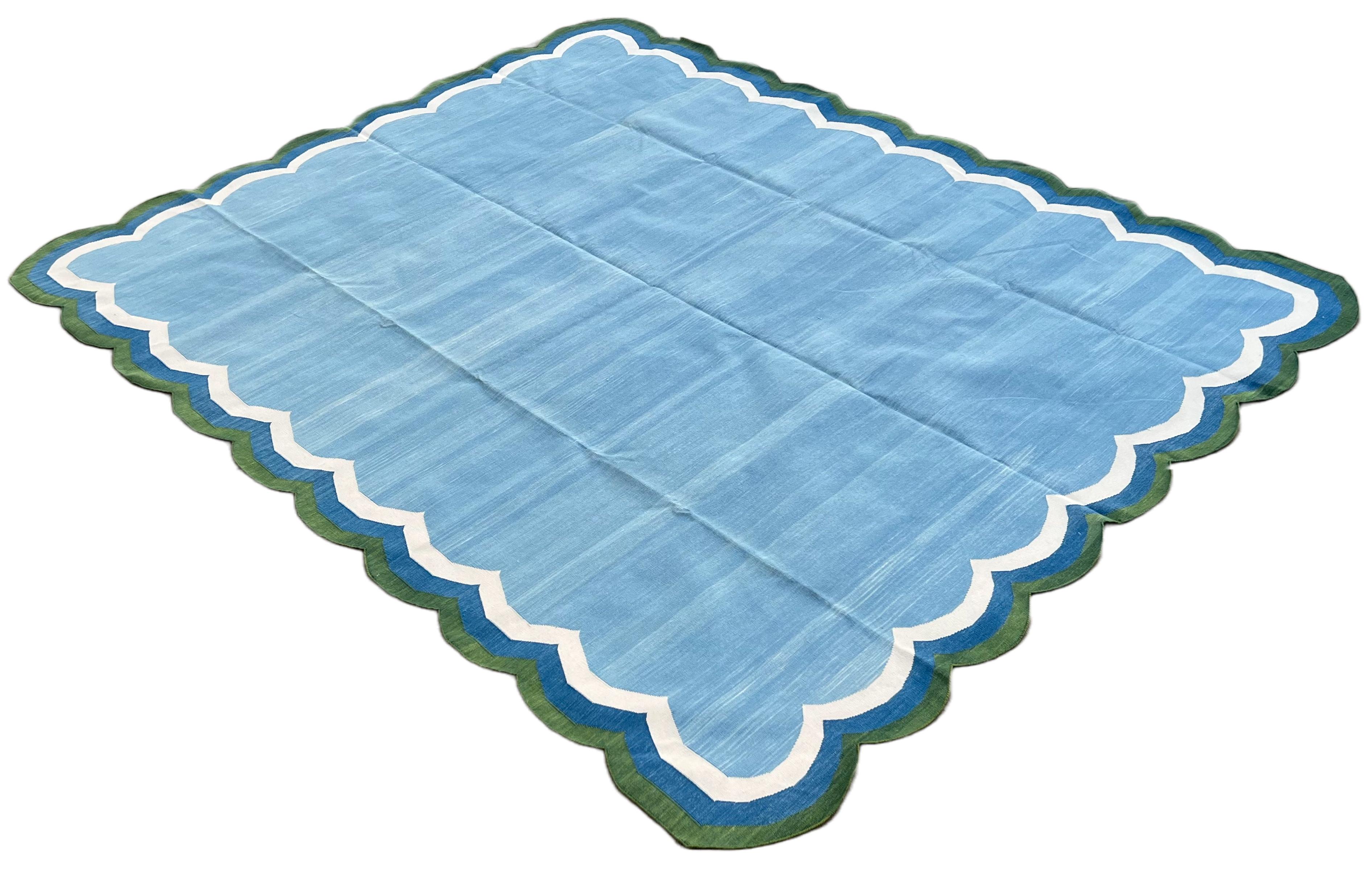Cotton Vegetable Dyed Sky Blue and Green 4 Sided Indian Scalloped Rug - 8'x10'
These special flat-weave dhurries are hand-woven with 15 ply 100% cotton yarn. Due to the special manufacturing techniques used to create our rugs, the size and color of