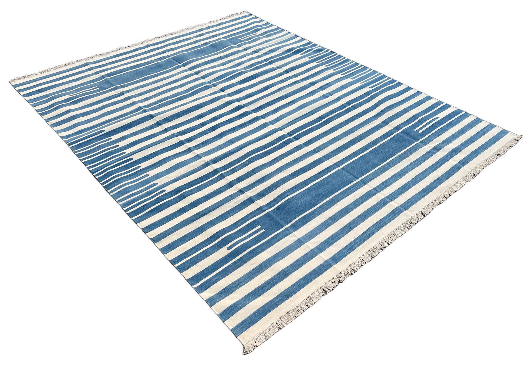 Cotton Natural Vegetable Dyed, Sky Blue And White Striped Indian Rug - 8'x10'
These special flat-weave dhurries are hand-woven with 15 ply 100% cotton yarn. Due to the special manufacturing techniques used to create our rugs, the size and color of