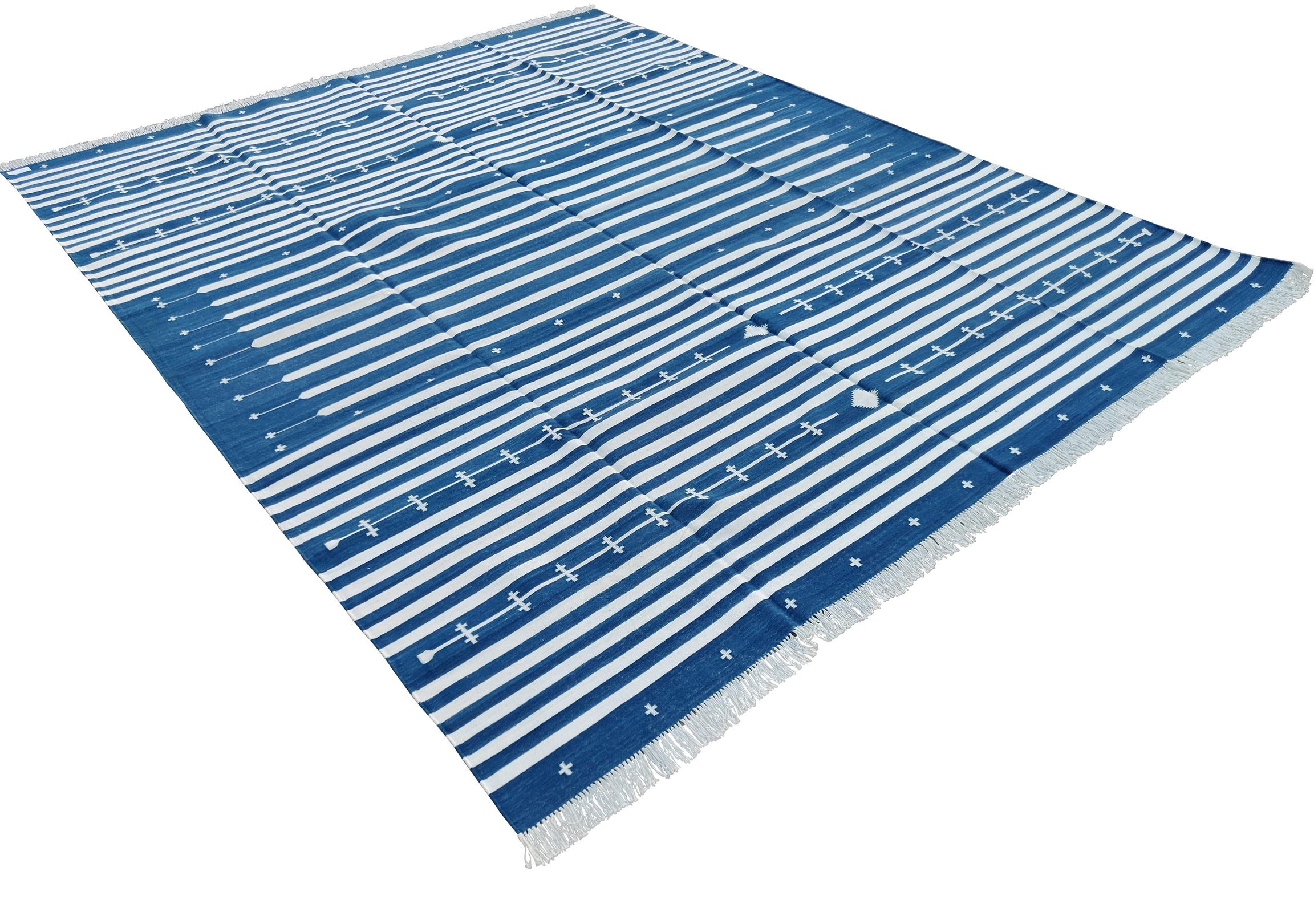 Cotton Vegetable Dyed Indigo Blue And White Striped Indian Dhurrie Rug-8'x10' 
These special flat-weave dhurries are hand-woven with 15 ply 100% cotton yarn. Due to the special manufacturing techniques used to create our rugs, the size and color of