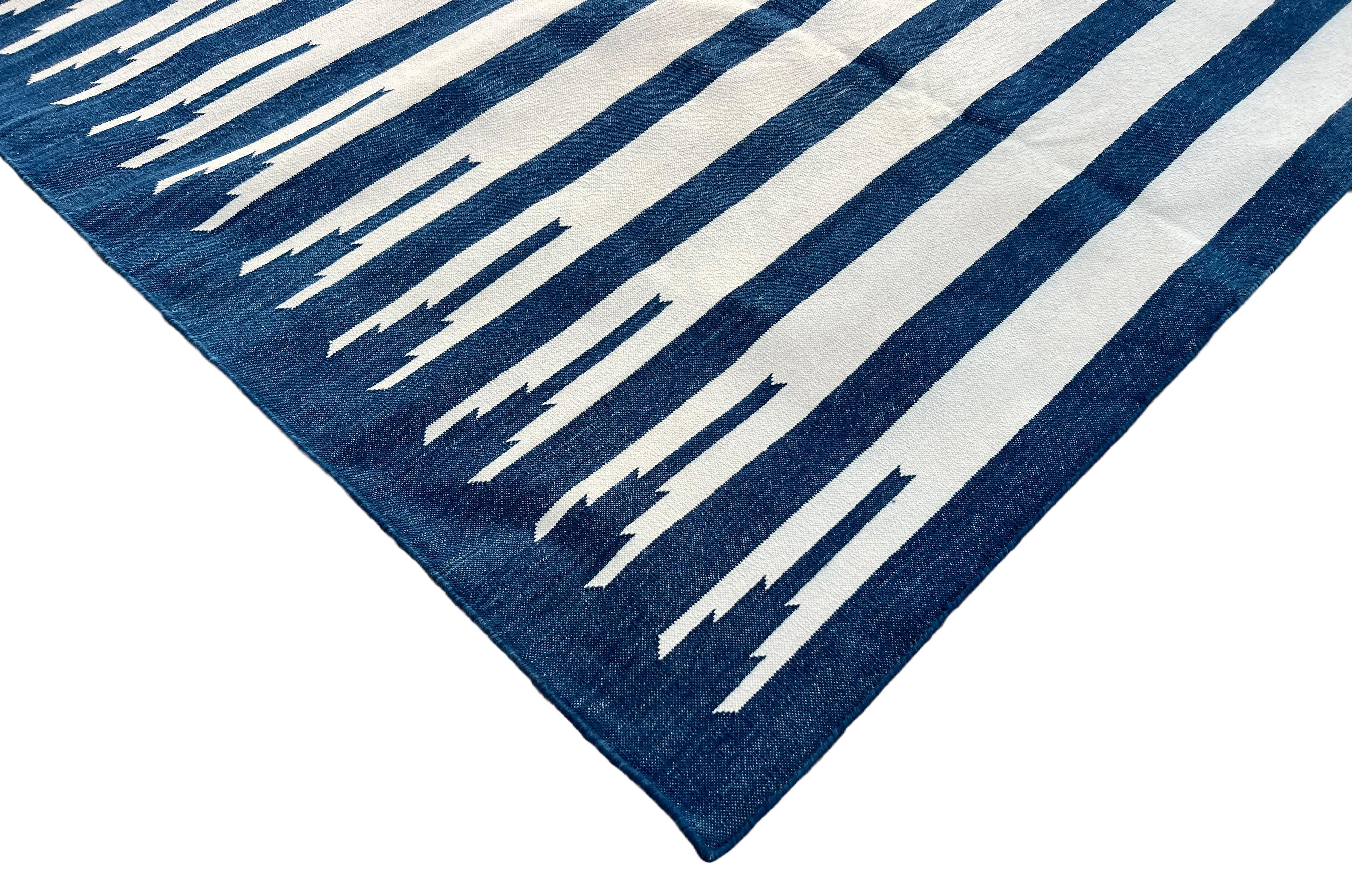 Cotton Vegetable Dyed Indigo Blue And White Striped Indian Dhurrie Rug- 8'x10' (240x300cm) 

These special flat-weave dhurries are hand-woven with 15 ply 100% cotton yarn. Due to the special manufacturing techniques used to create our rugs, the size