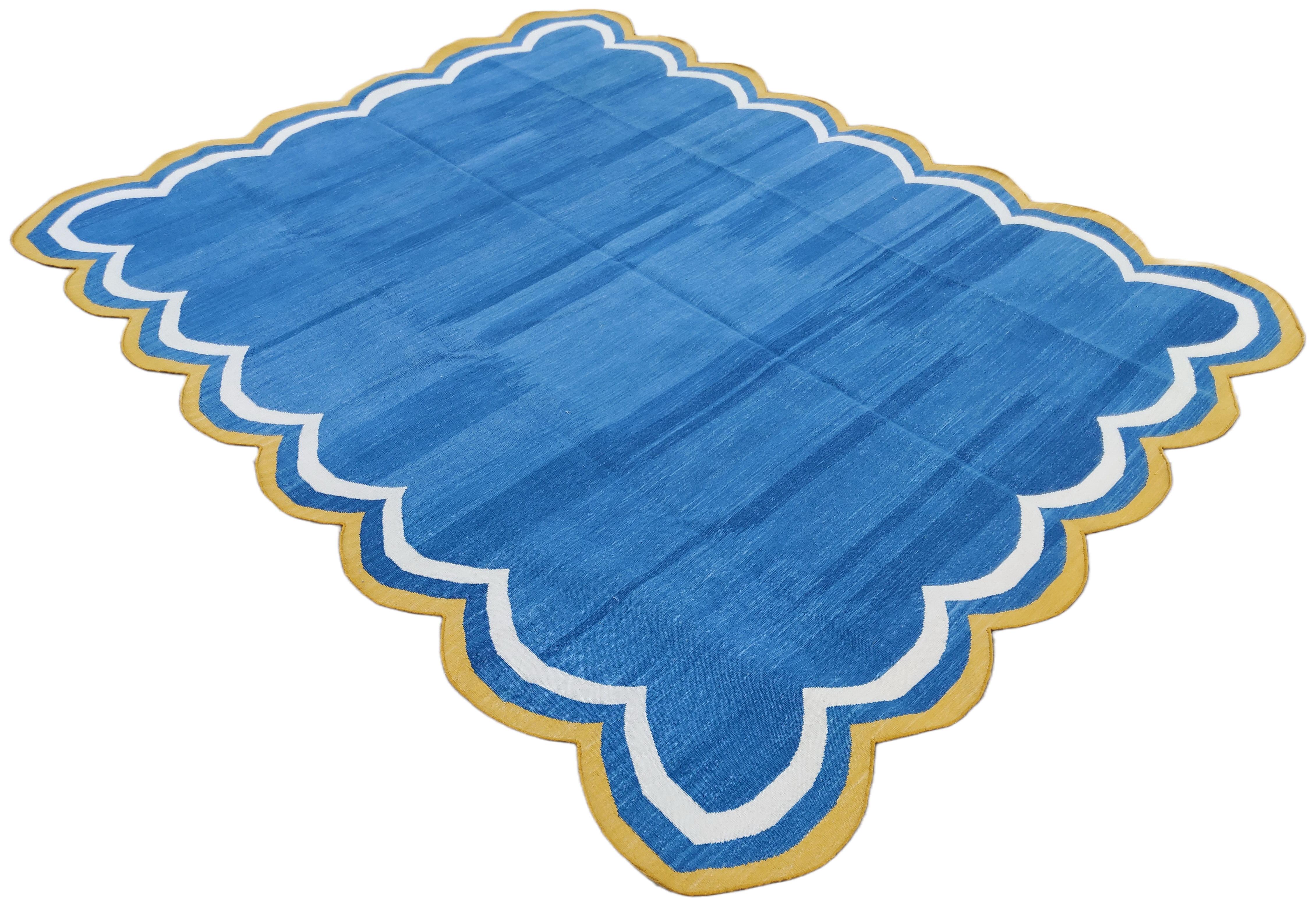 Cotton Vegetable Dyed Indigo Blue, Cream And Yellow Four Sided Scalloped Rug-8'x10' 
(Scallops runs all four Sides)
These special flat-weave dhurries are hand-woven with 15 ply 100% cotton yarn. Due to the special manufacturing techniques used to