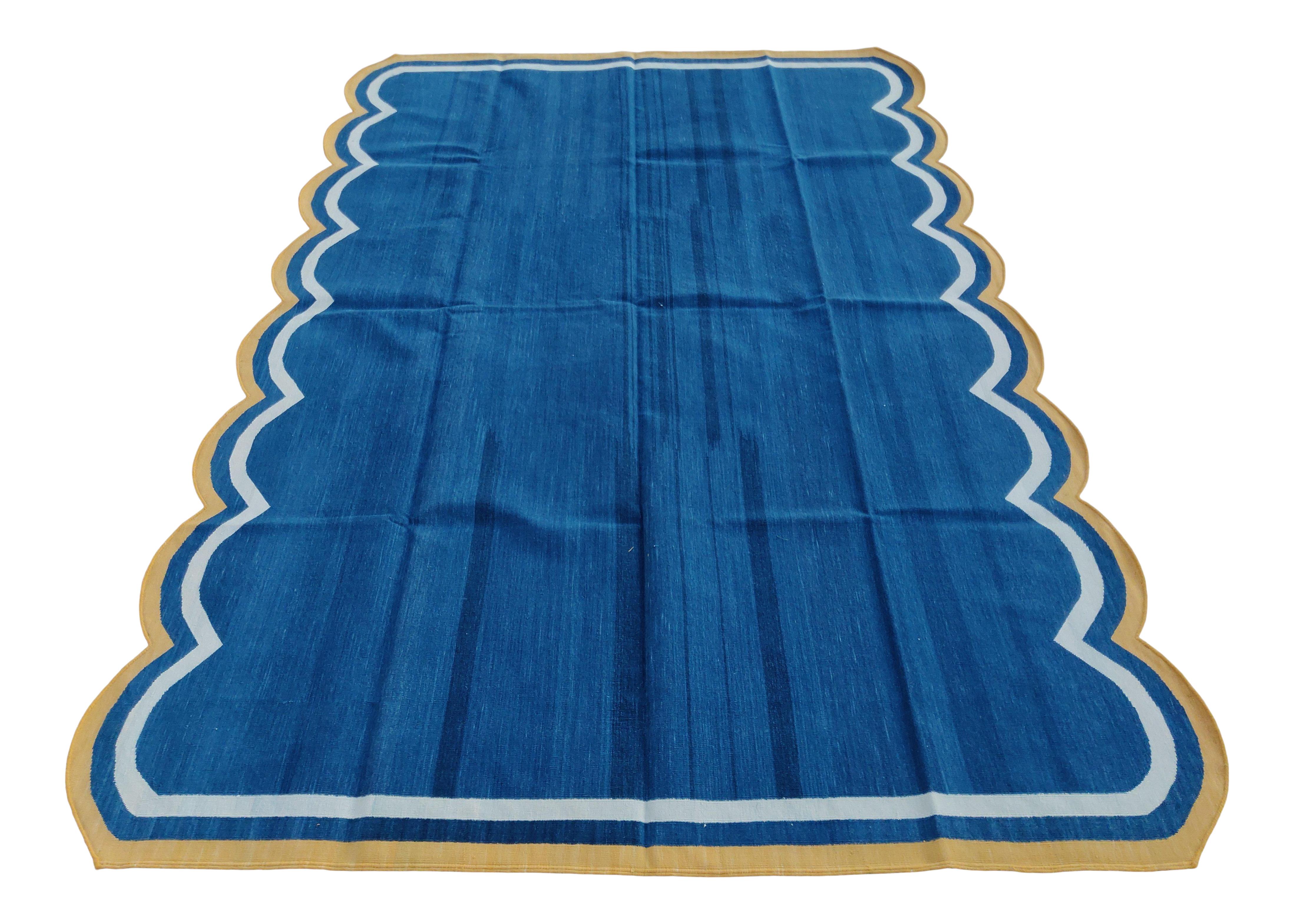 Cotton Vegetable Dyed Indigo Blue, Cream And Yellow Two Sided Scalloped Rug-8'x10' 
(Scallops runs on 10 Feet Sides)
These special flat-weave dhurries are hand-woven with 15 ply 100% cotton yarn. Due to the special manufacturing techniques used to