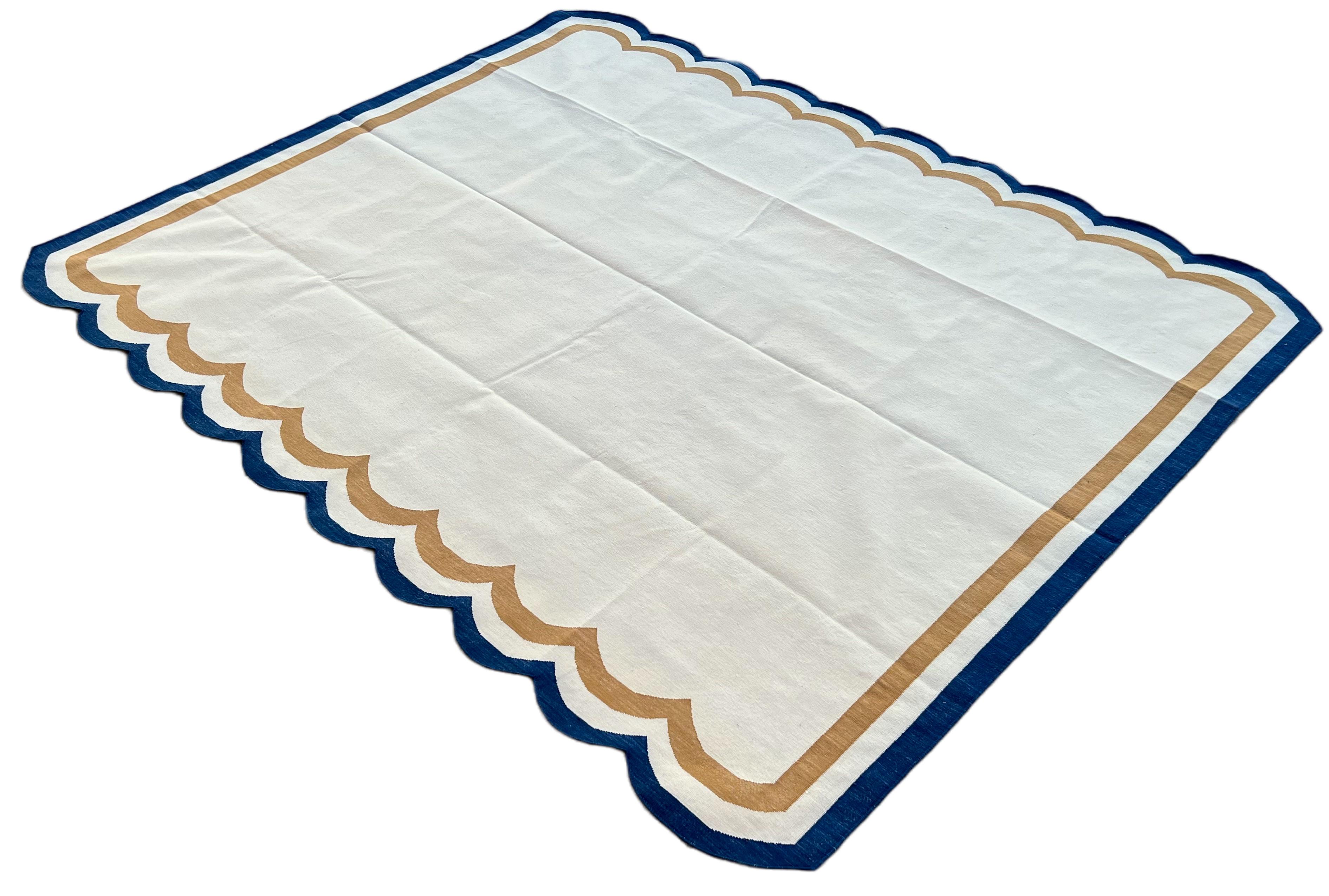 Cotton Vegetable Dyed Cream, Tan and Navy Blue 2 Sided Indian Scalloped Rug - 8'x10'
These special flat-weave dhurries are hand-woven with 15 ply 100% cotton yarn. Due to the special manufacturing techniques used to create our rugs, the size and