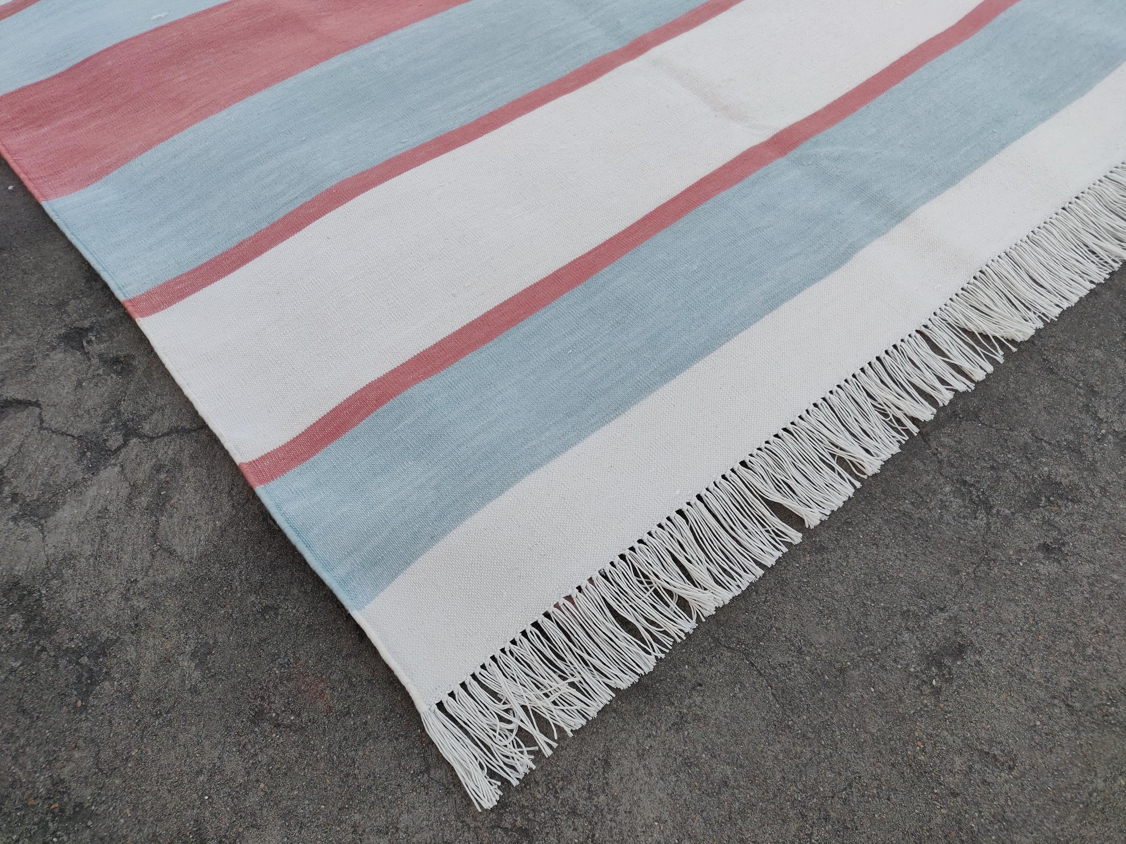 Cotton Vegetable Dyed Pale Aqua and Red Striped Indian Dhurrie Rug-8'x10' 

These special flat-weave dhurries are hand-woven with 15 ply 100% cotton yarn. Due to the special manufacturing techniques used to create our rugs, the size and color of