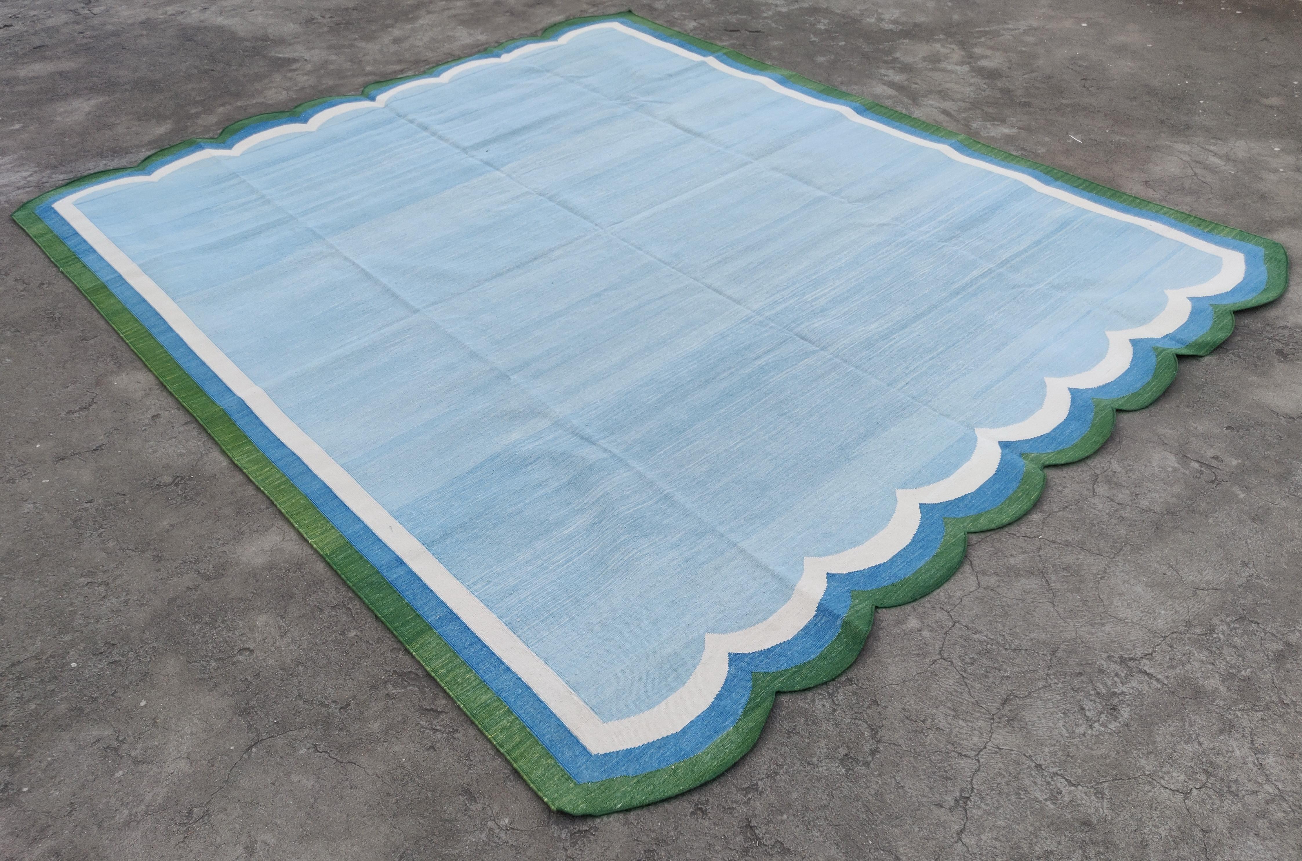 Cotton Vegetable Dyed Sky Blue, Cream And Forest Green Four Sided Scalloped Rug-8'x10' (Scallops runs all 4 Sides)
These special flat-weave dhurries are hand-woven with 15 ply 100% cotton yarn. Due to the special manufacturing techniques used to