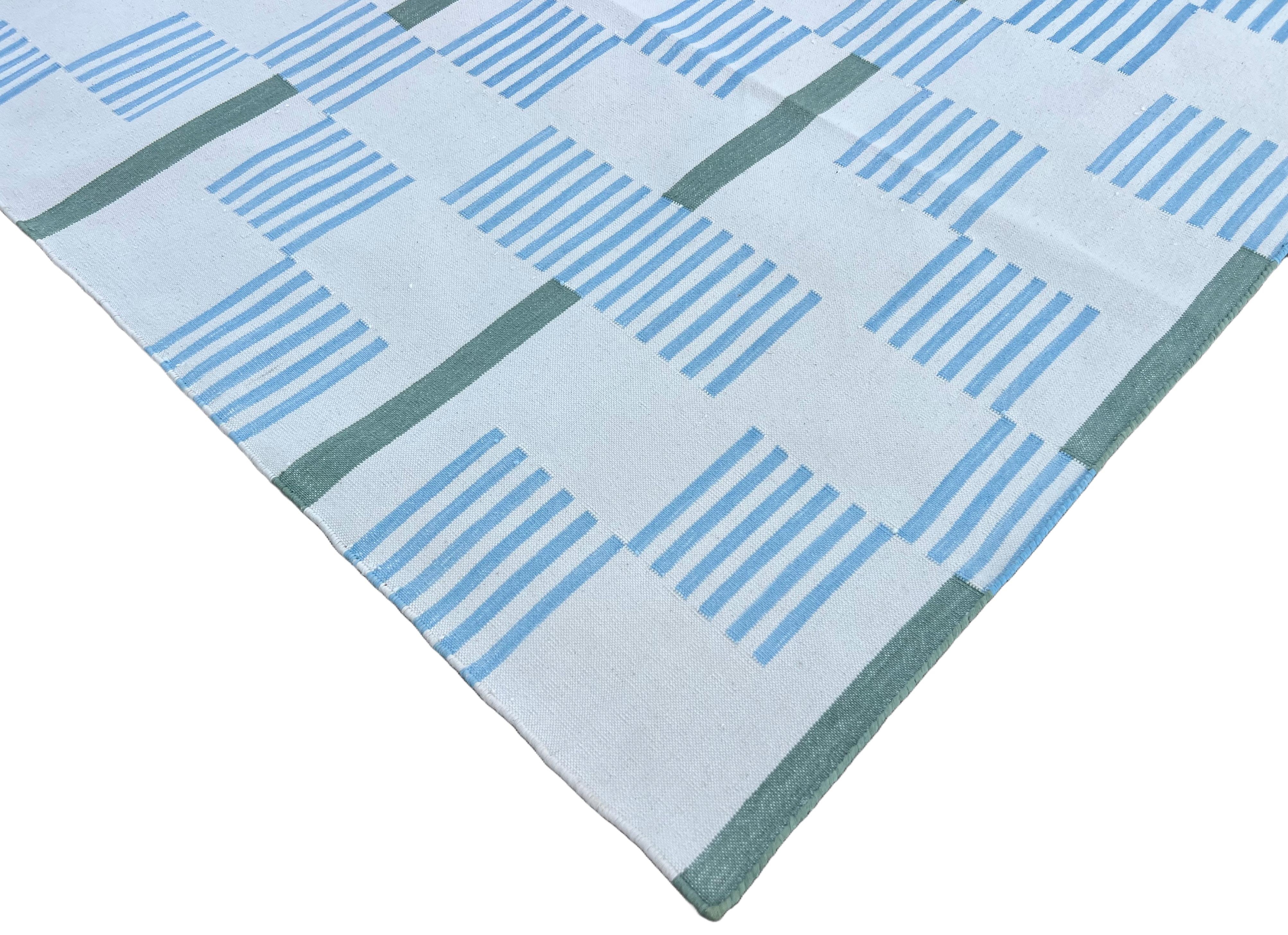 Cotton Natural Vegetable Dyed Natural White, Sky Blue, Green And Tan Striped And Star Dash Rug-8'x10' (240x300cm)

These special flat-weave dhurries are hand-woven with 15 ply 100% cotton yarn. Due to the special manufacturing techniques used to