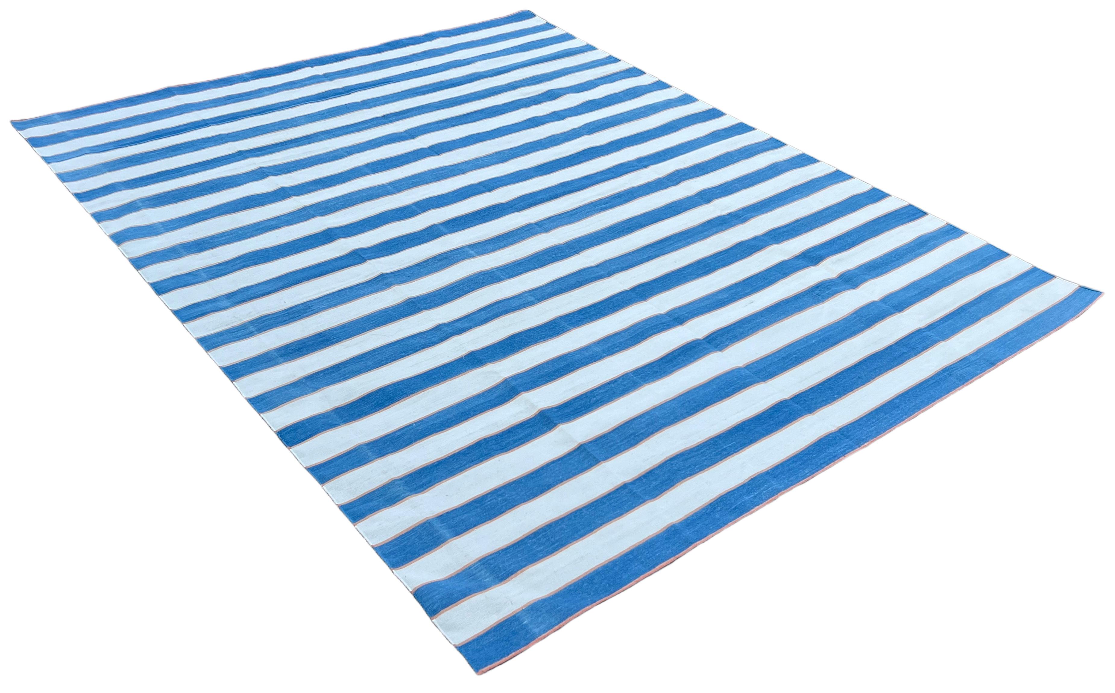 Cotton Natural Vegetable Dyed, Sky Blue, Orange And Cream Striped Indian Rug - Size 9'x12' (270x360cm)
These special flat-weave dhurries are hand-woven with 15 ply 100% cotton yarn. Due to the special manufacturing techniques used to create our
