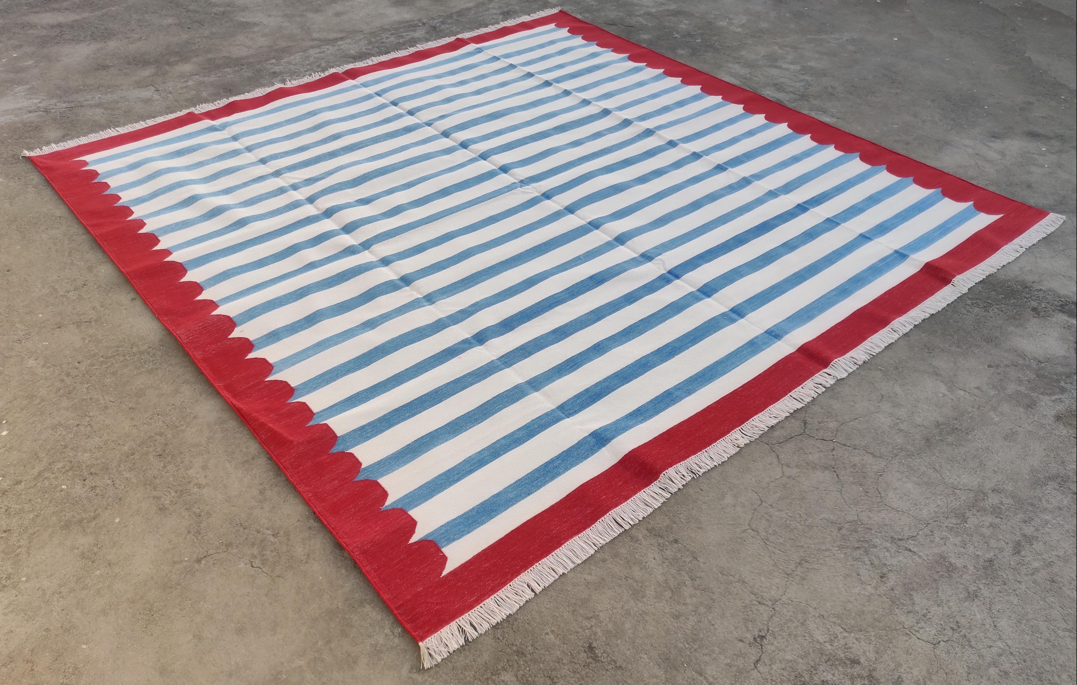 Cotton Vegetable Dyed Blue, White And Red Striped Indian Dhurrie Rug-9'x12'

These special flat-weave dhurries are hand-woven with 15 ply 100% cotton yarn. Due to the special manufacturing techniques used to create our rugs, the size and color of