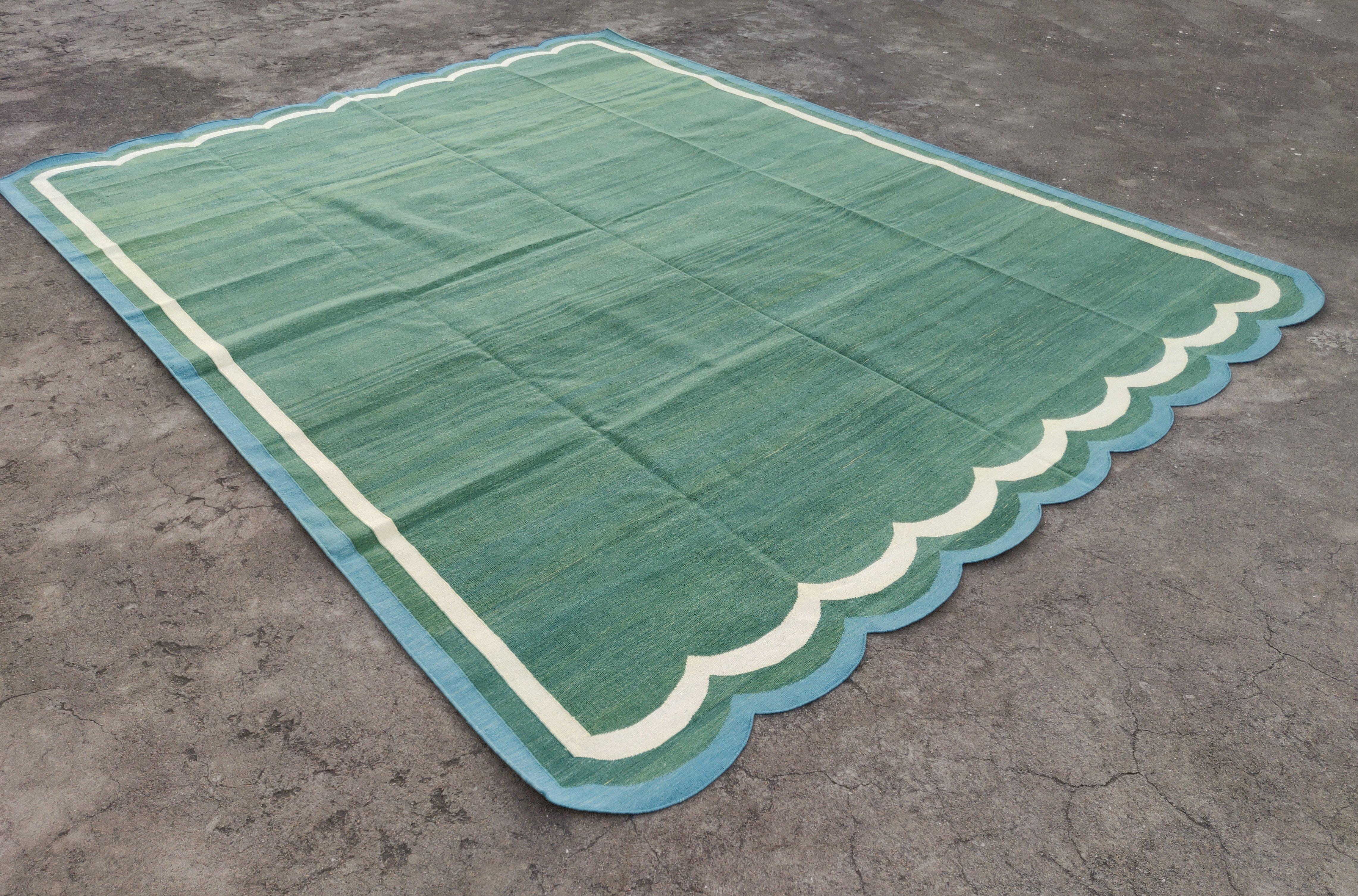 Cotton Vegetable Dyed Forest Green, Cream And Teal Blue Two Sided Scalloped Rug-9'x12' 
(Scallops runs on all 9 Feet Sides)
These special flat-weave dhurries are hand-woven with 15 ply 100% cotton yarn. Due to the special manufacturing techniques