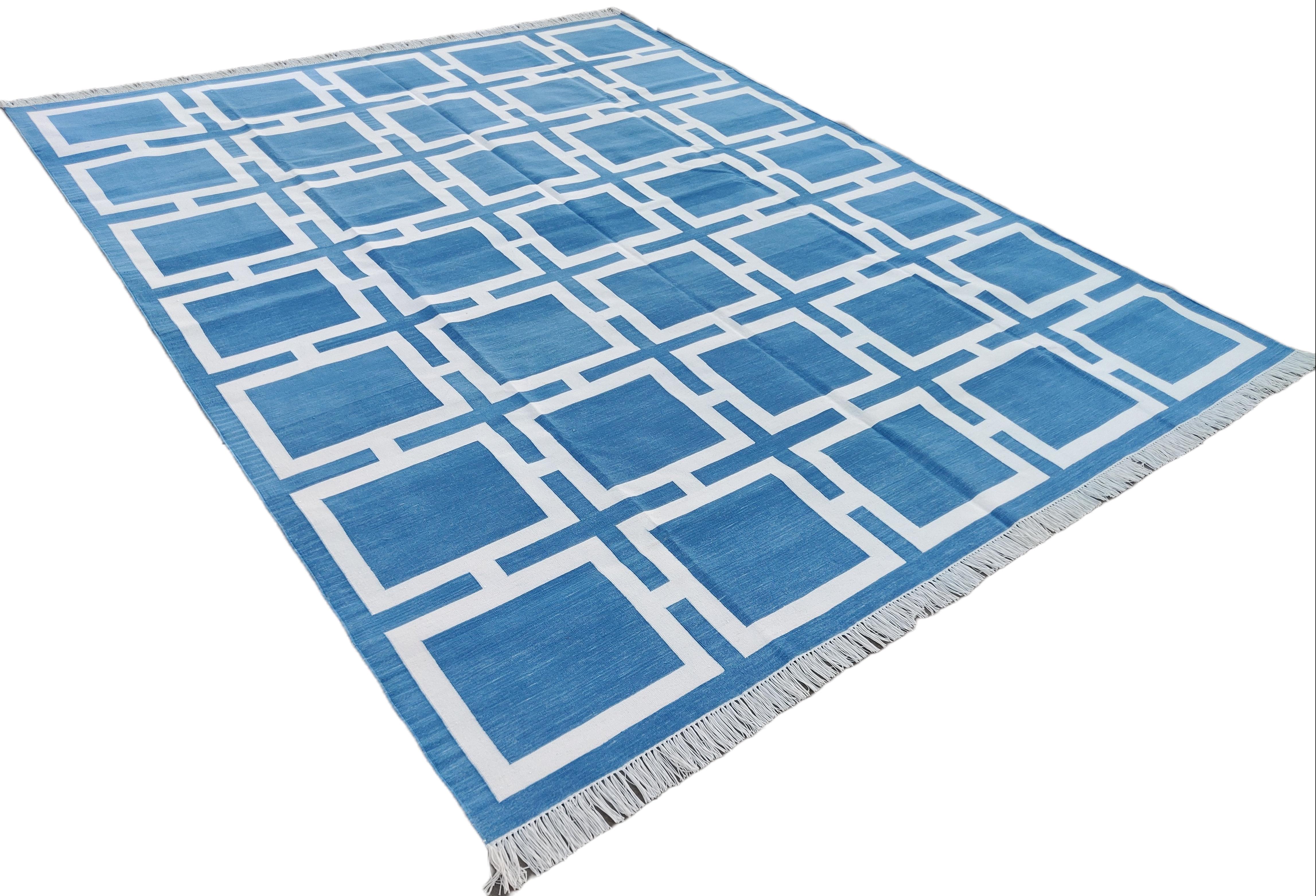 Cotton Vegetable Dyed Reversible Sky Blue And White Geometric Patterned Indian Rug - 8'x10'
These special flat-weave dhurries are hand-woven with 15 ply 100% cotton yarn. Due to the special manufacturing techniques used to create our rugs, the size