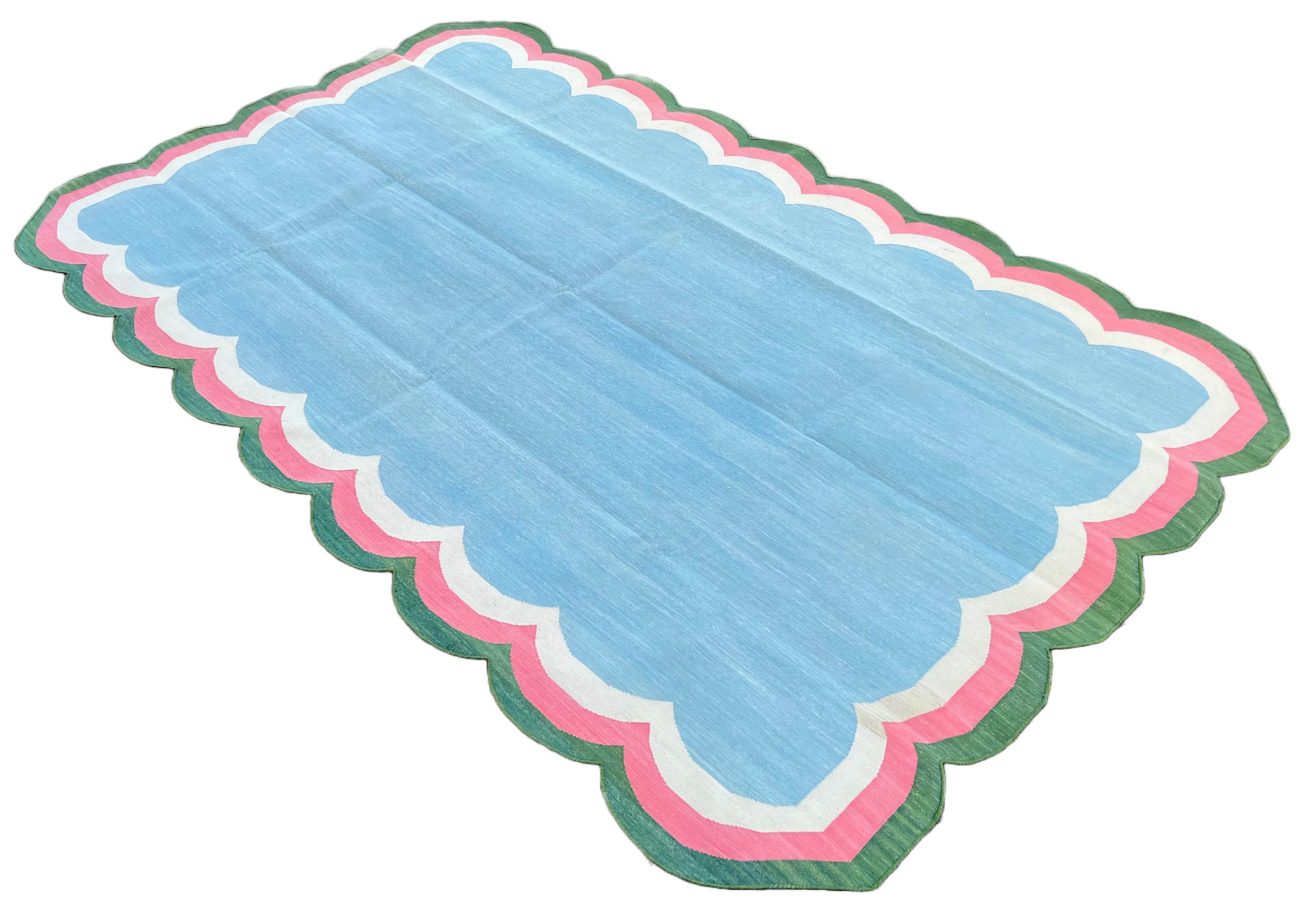 Cotton Vegetable Dyed Reversible Sky Blue, White, Pink And Green Four Sided Scalloped Indian Rug - 5'x8'
These special flat-weave dhurries are hand-woven with 15 ply 100% cotton yarn. Due to the special manufacturing techniques used to create our