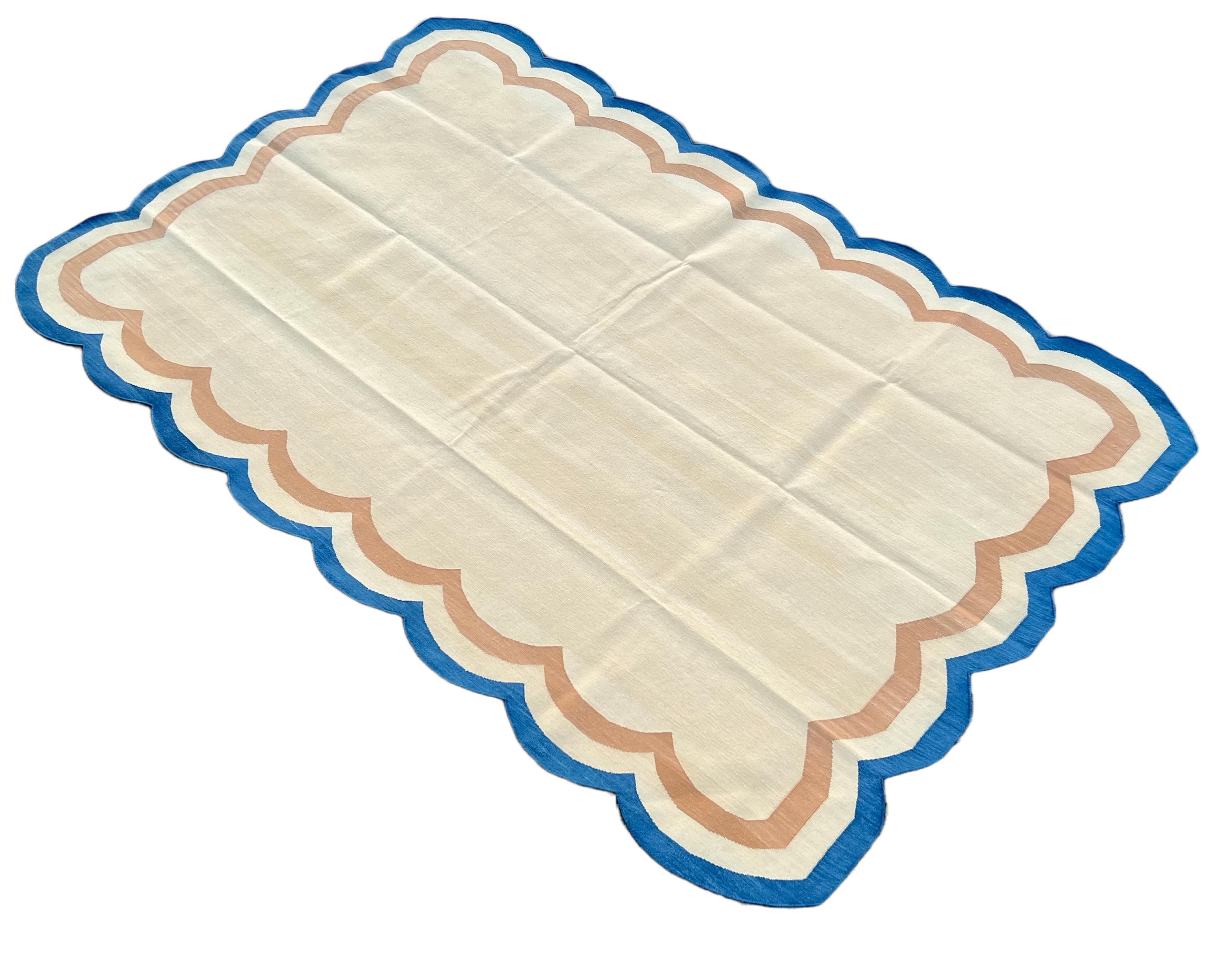 Cotton Vegetable Dyed Reversible Cream, Mustard And Blue Four Sided Scalloped Indian Rug - 5'x8'
These special flat-weave dhurries are hand-woven with 15 ply 100% cotton yarn. Due to the special manufacturing techniques used to create our rugs, the