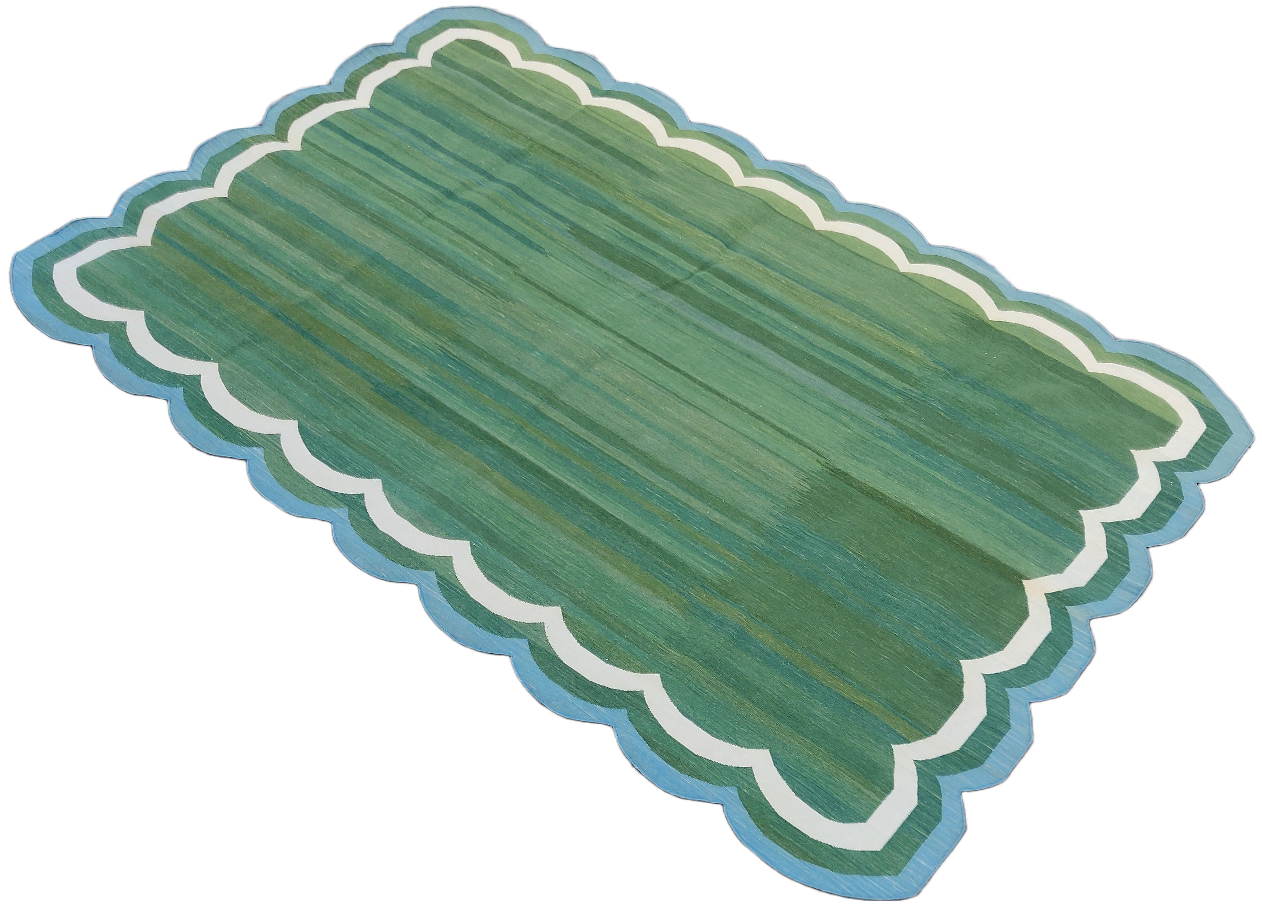 Cotton Vegetable Dyed Forest Green And Blue Four Sided Scalloped Rug-6'x9'
These special flat-weave dhurries are hand-woven with 15 ply 100% cotton yarn. Due to the special manufacturing techniques used to create our rugs, the size and color of each
