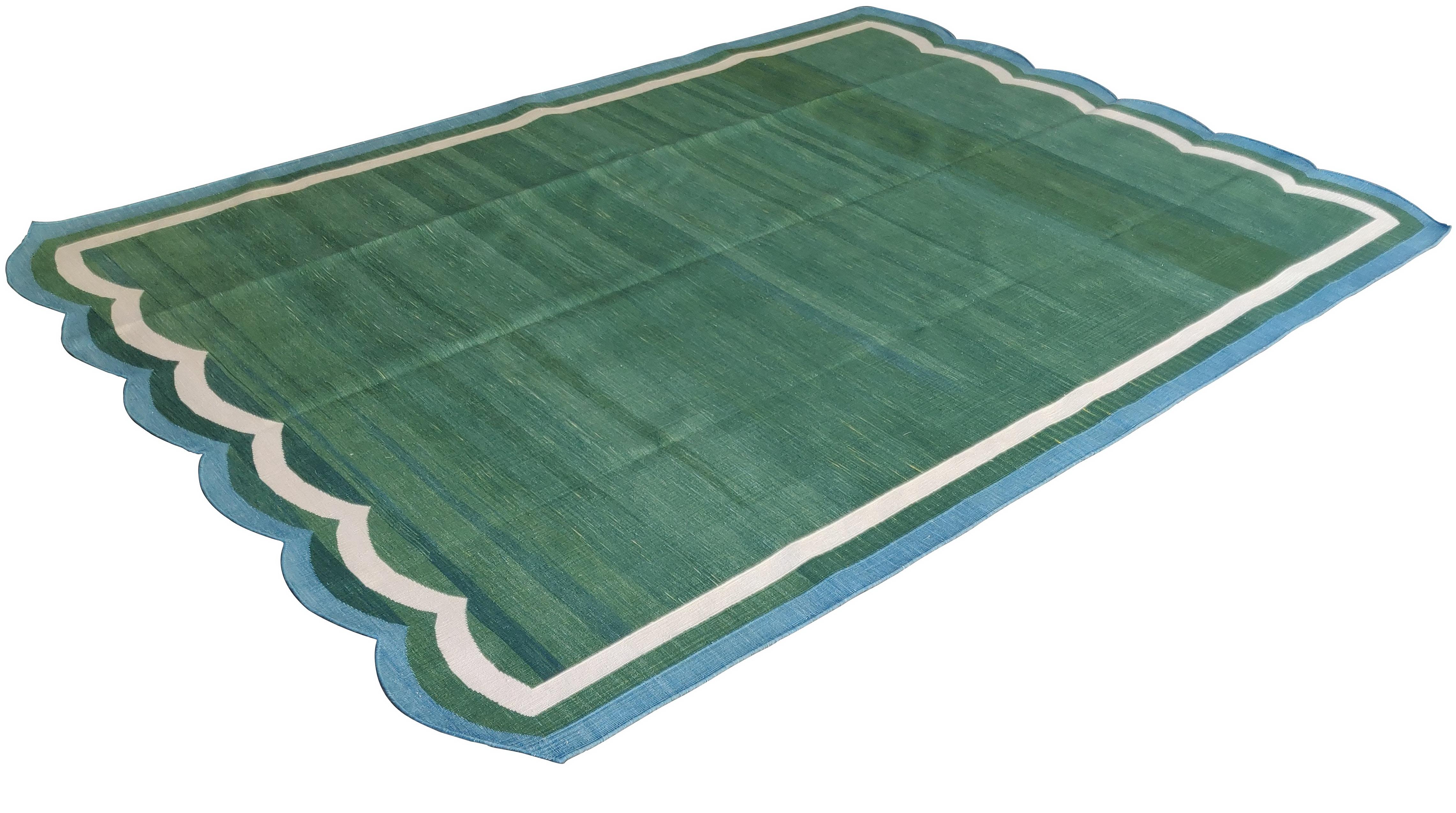Cotton Vegetable Dyed Forest Green And Blue Two Sided Scalloped Rug-6'x9'
These special flat-weave dhurries are hand-woven with 15 ply 100% cotton yarn. Due to the special manufacturing techniques used to create our rugs, the size and color of each