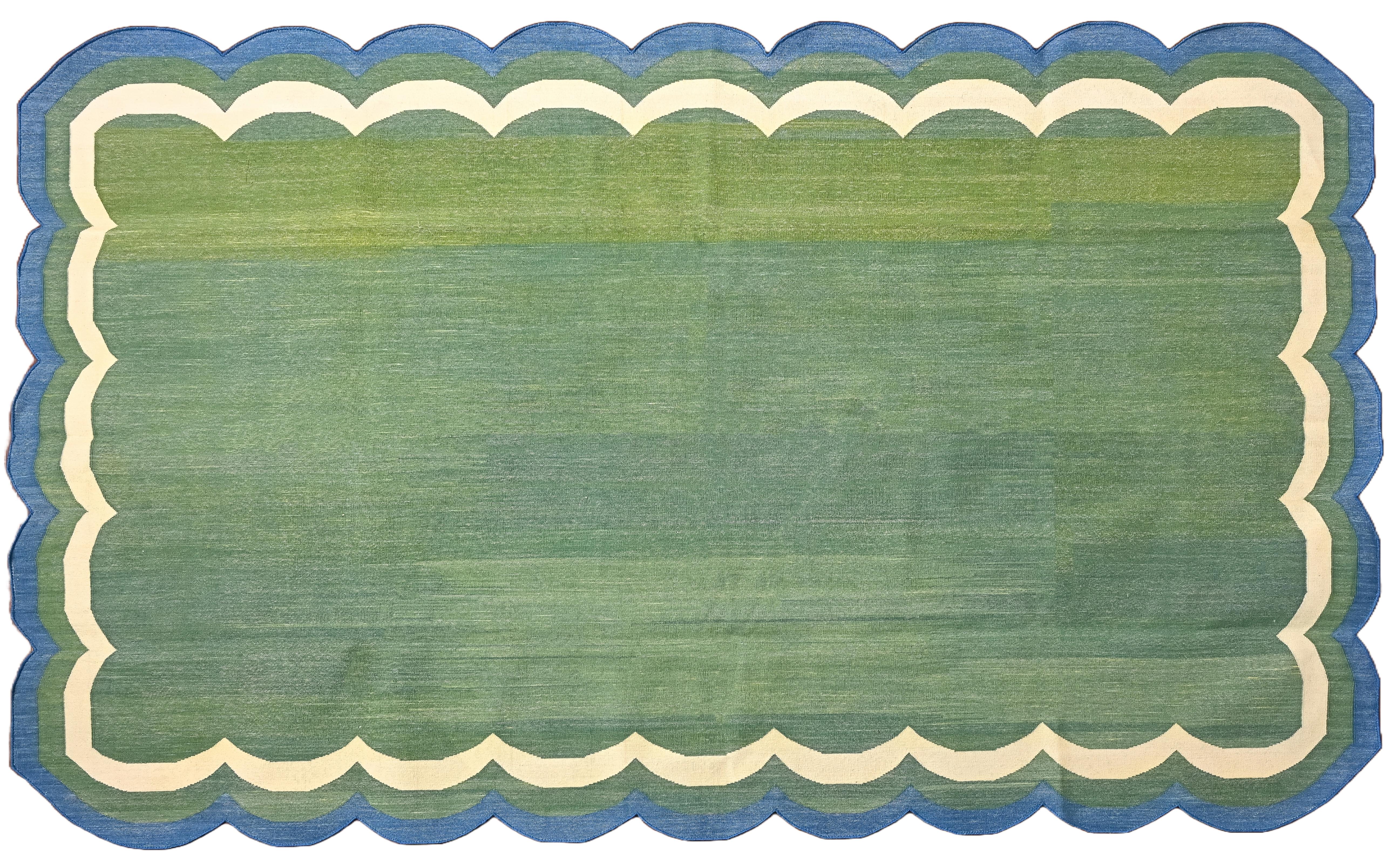Cotton Vegetable Dyed Reversible Forest Green And Teal Blue Four Sided Scalloped Indian Rug - 5'x7'
These special flat-weave dhurries are hand-woven with 15 ply 100% cotton yarn. Due to the special manufacturing techniques used to create our rugs,