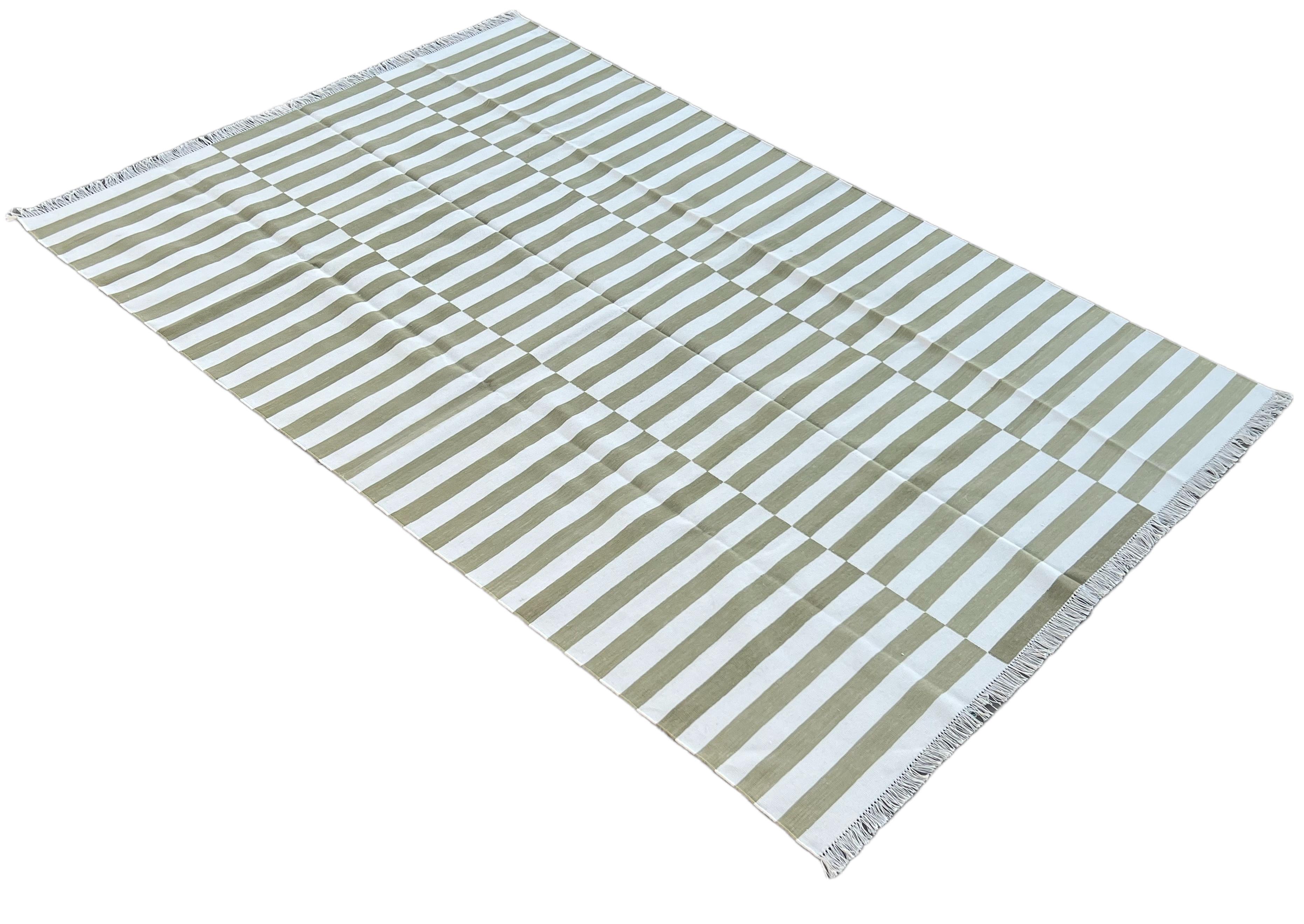 Cotton Natural Vegetable Dyed Olive Green And White Up Down Striped Indian Rug-6'x9'
These special flat-weave dhurries are hand-woven with 15 ply 100% cotton yarn. Due to the special manufacturing techniques used to create our rugs, the size and