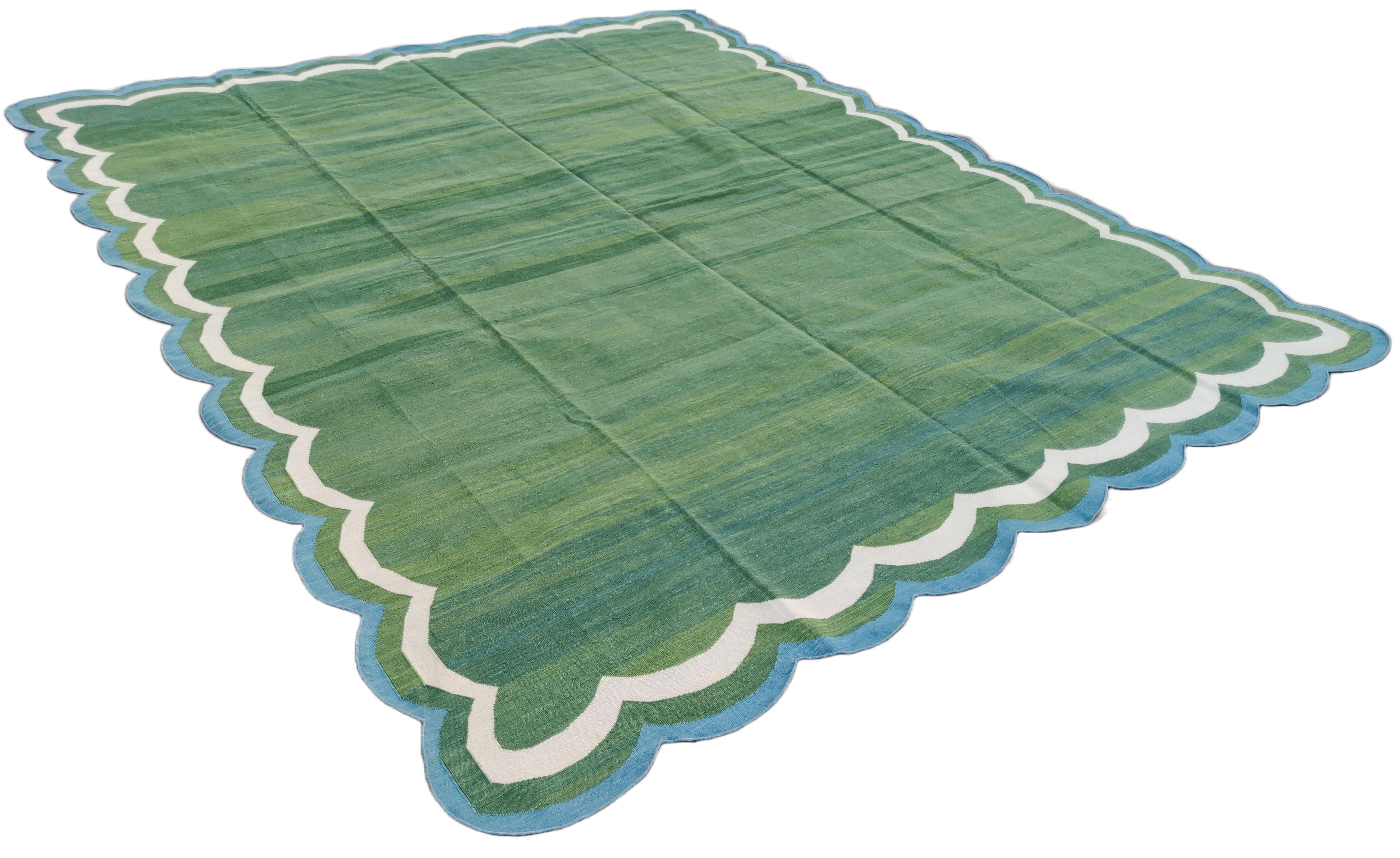 Cotton Vegetable Dyed Area Rug, Forest Green And Blue Four Sided Scalloped Rug-9'x12'
These special flat-weave dhurries are hand-woven with 15 ply 100% cotton yarn. Due to the special manufacturing techniques used to create our rugs, the size and