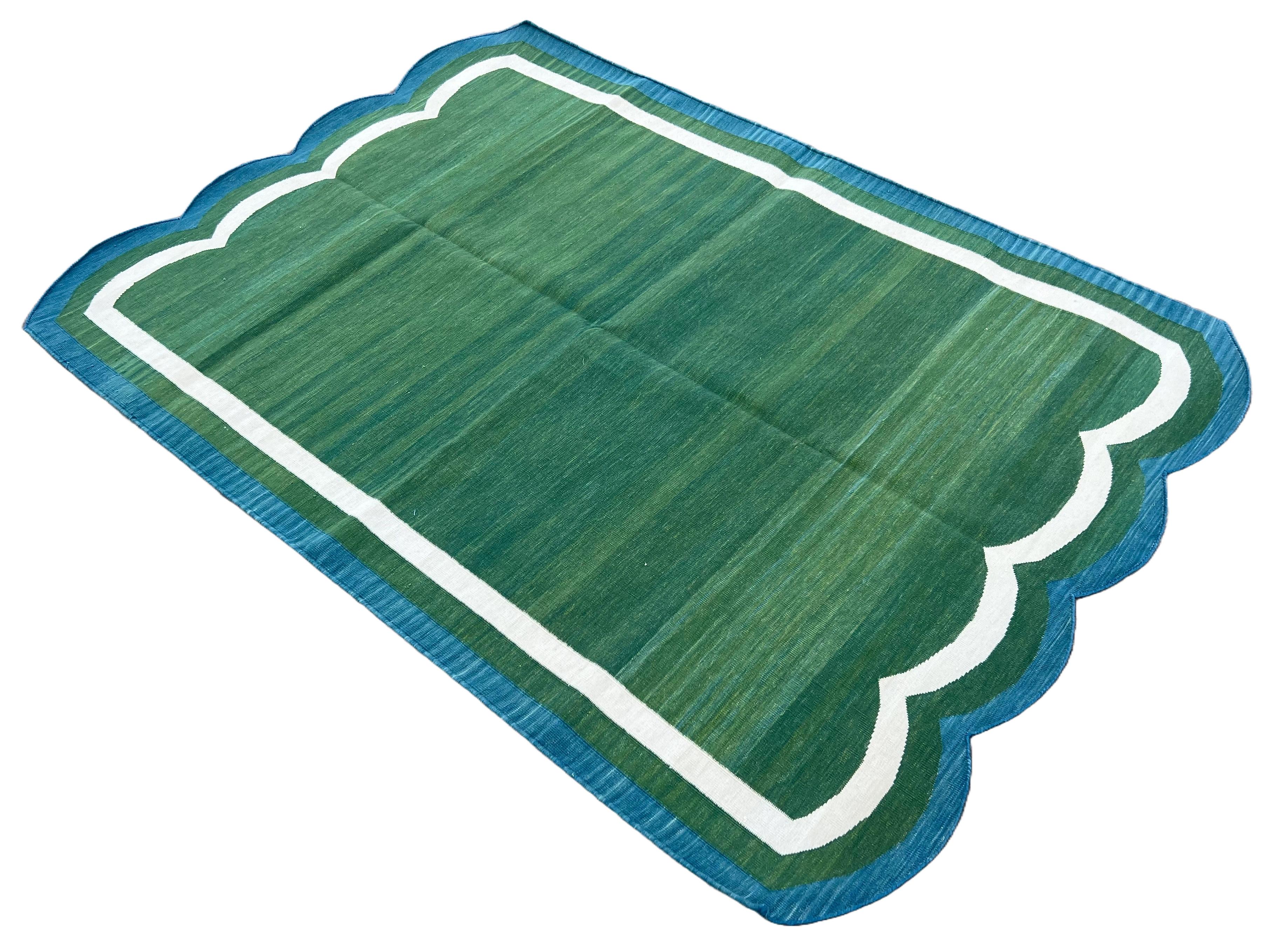 Cotton Vegetable Dyed Forest Green & Teal Blue Two Sided Scalloped Rug-4'x6' (Scallops runs on all 4 Sides)
These special flat-weave dhurries are hand-woven with 15 ply 100% cotton yarn. Due to the special manufacturing techniques used to create our