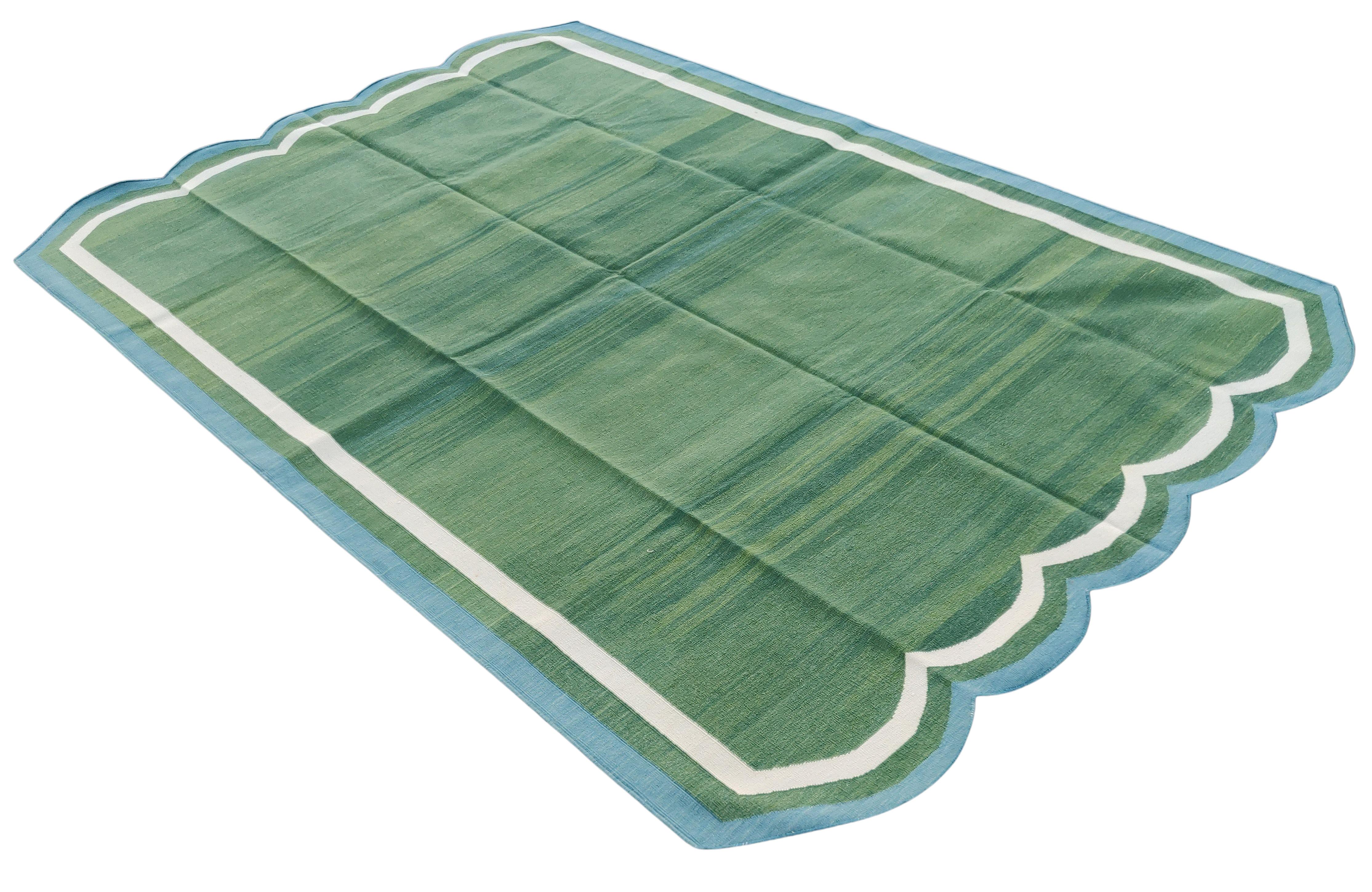 Cotton Vegetable Dyed Forest Green & Teal Blue Two Sided Scalloped Rug-5'x8' (Scallops runs on all 5' Sides)
These special flat-weave dhurries are hand-woven with 15 ply 100% cotton yarn. Due to the special manufacturing techniques used to create