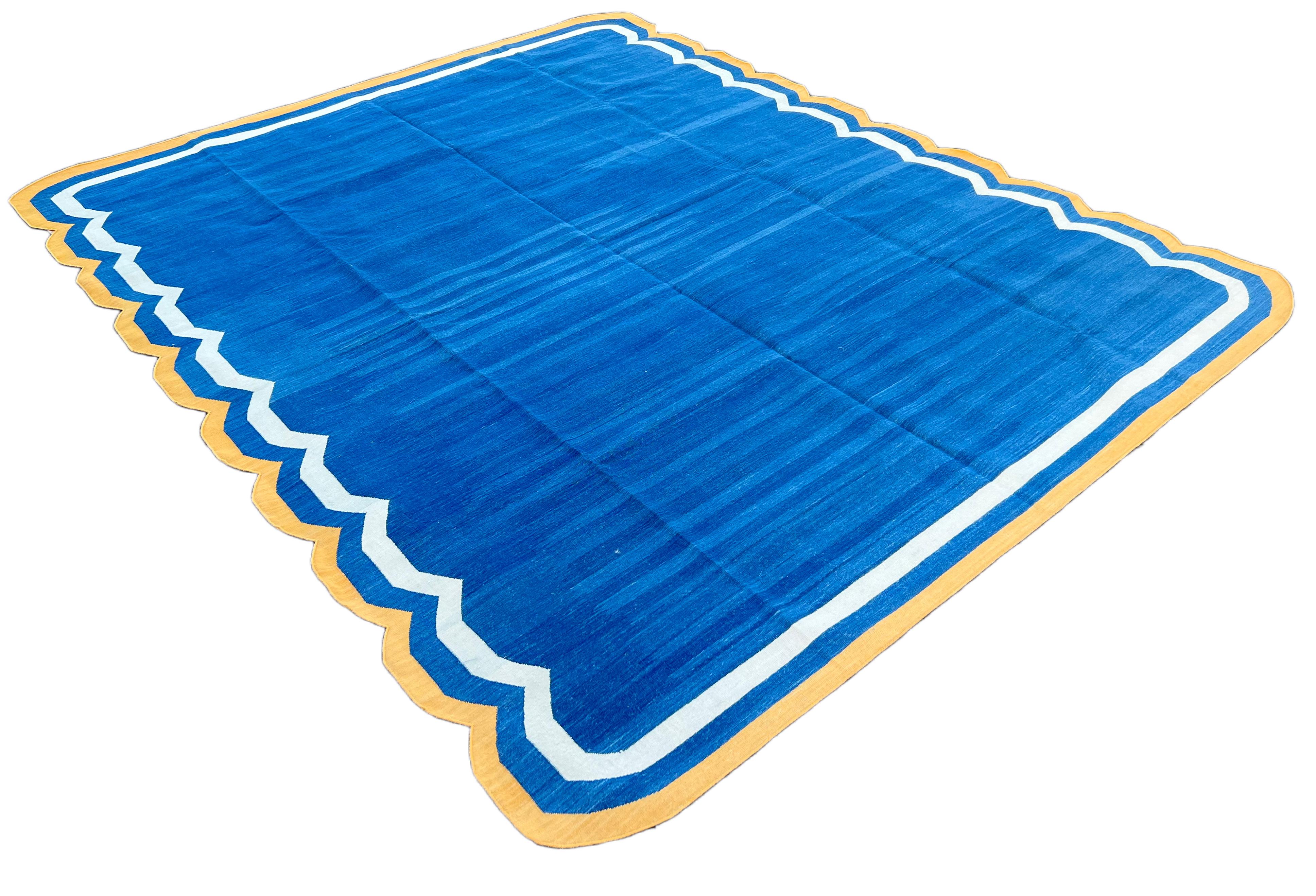 Cotton Vegetable Dyed Forest Indigo Blue &  Yellow Two Sided Scalloped Rug-8'x10' (Scallops runs on 10' Sides)
These special flat-weave dhurries are hand-woven with 15 ply 100% cotton yarn. Due to the special manufacturing techniques used to create