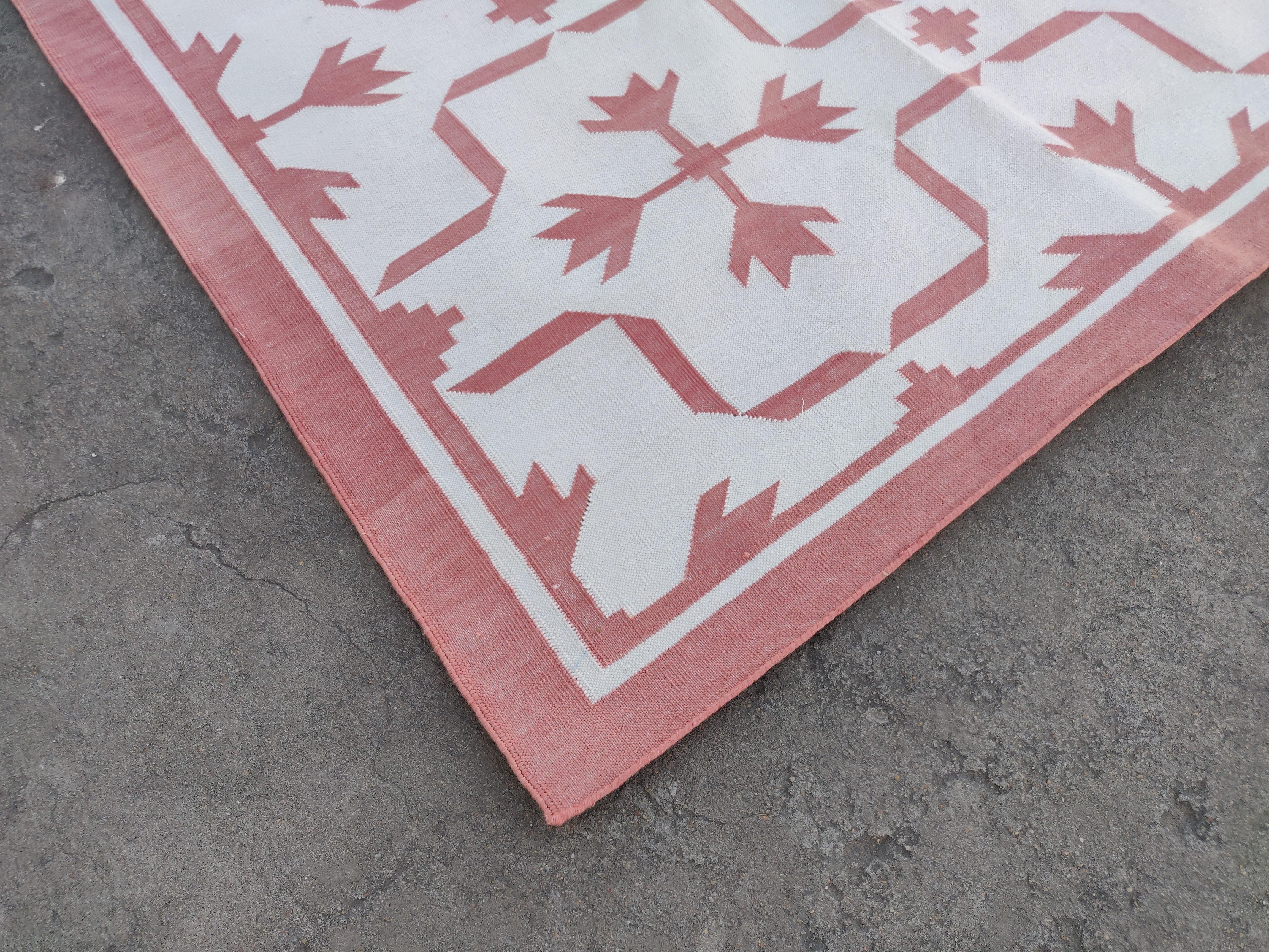 Cotton Vegetable Dyed Reversible Rose Pink And White Leaf Patterned Indian Rug - 8'x10'
These special flat-weave dhurries are hand-woven with 15 ply 100% cotton yarn. Due to the special manufacturing techniques used to create our rugs, the size and