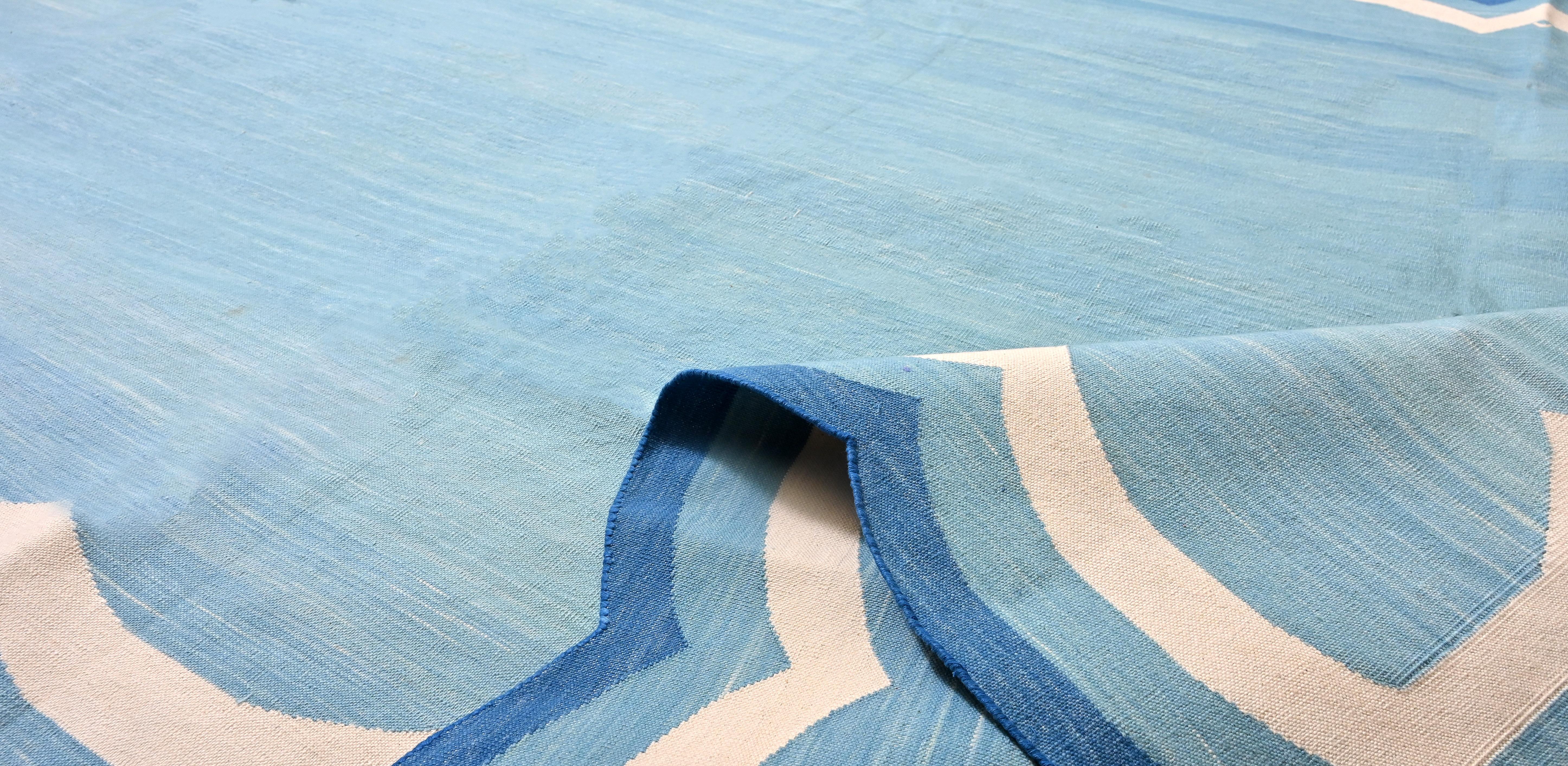 Cotton Vegetable Dyed Reversible Teal Blue And White Four Sided Scalloped Indian Rug - 5'x7'
These special flat-weave dhurries are hand-woven with 15 ply 100% cotton yarn. Due to the special manufacturing techniques used to create our rugs, the size