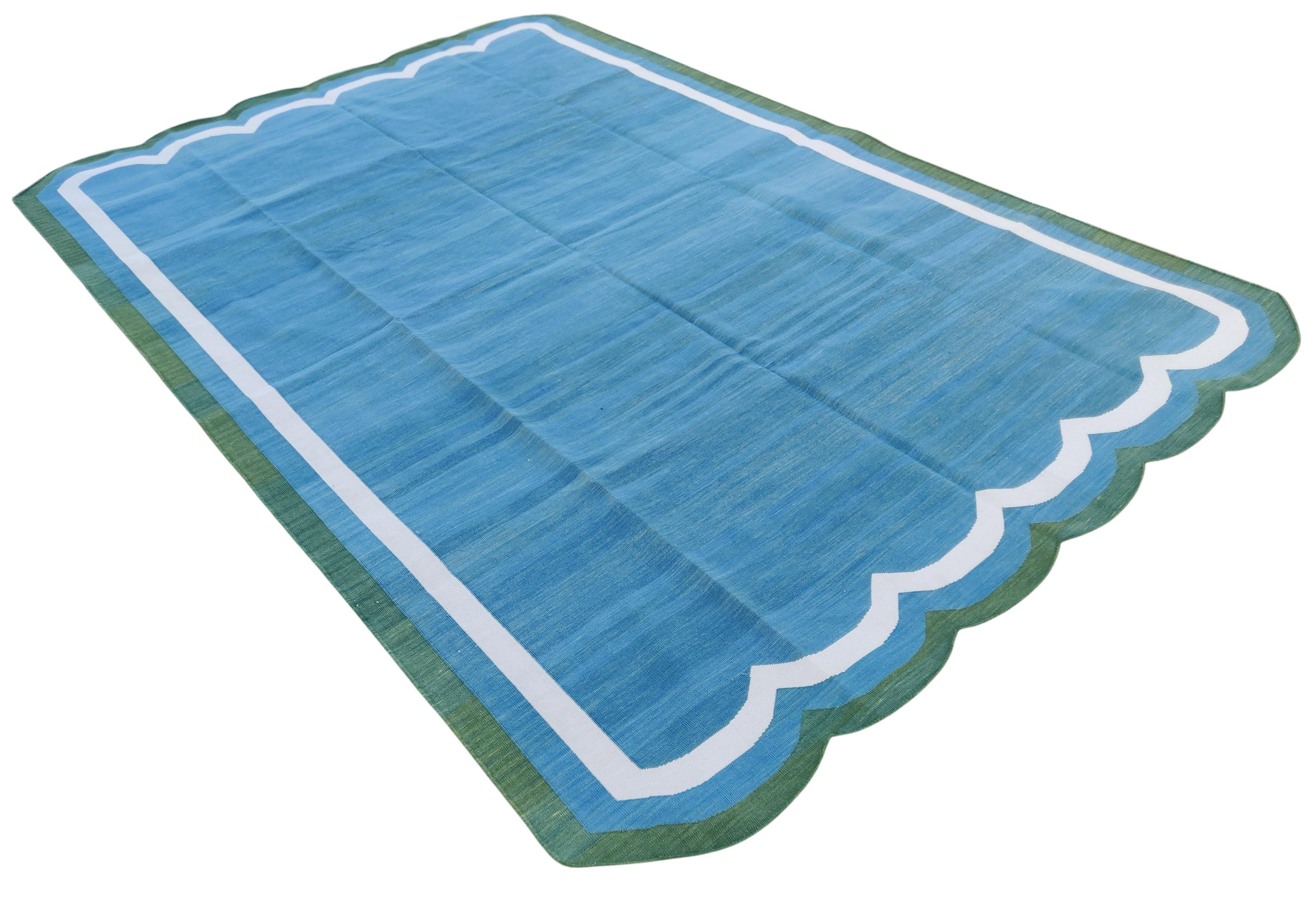 Cotton Vegetable Dyed Teal Blue And Forest Green Two Sided Scalloped Rug-6'x9' (Scallops runs on all 6' Sides)
These special flat-weave dhurries are hand-woven with 15 ply 100% cotton yarn. Due to the special manufacturing techniques used to create