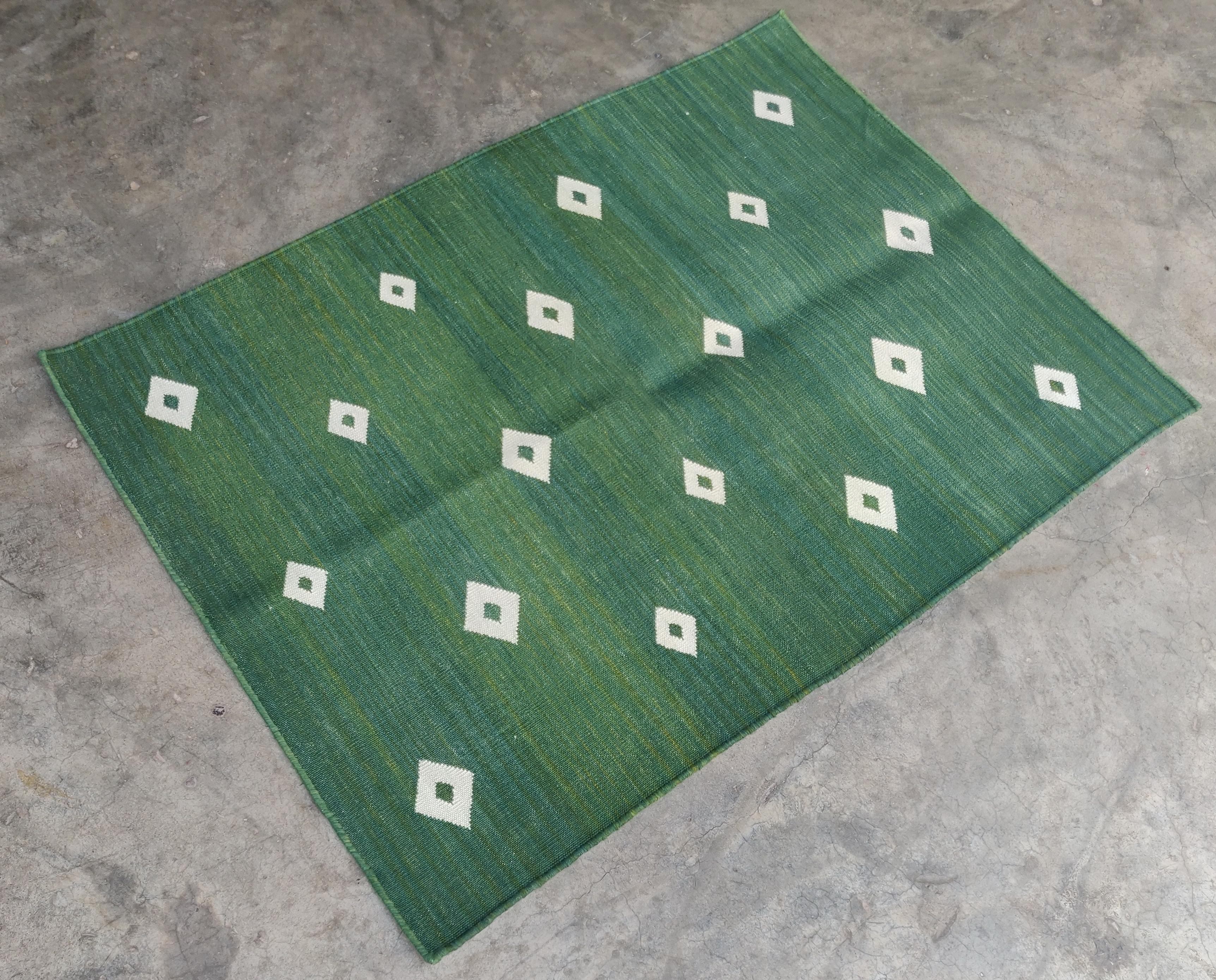 Cotton Vegetable Dyed Area Rug, Green and White Diamond Pattern Indian Rug-2'x3'

These special flat-weave dhurries are hand-woven with 15 ply 100% cotton yarn. Due to the special manufacturing techniques used to create our rugs, the size and color