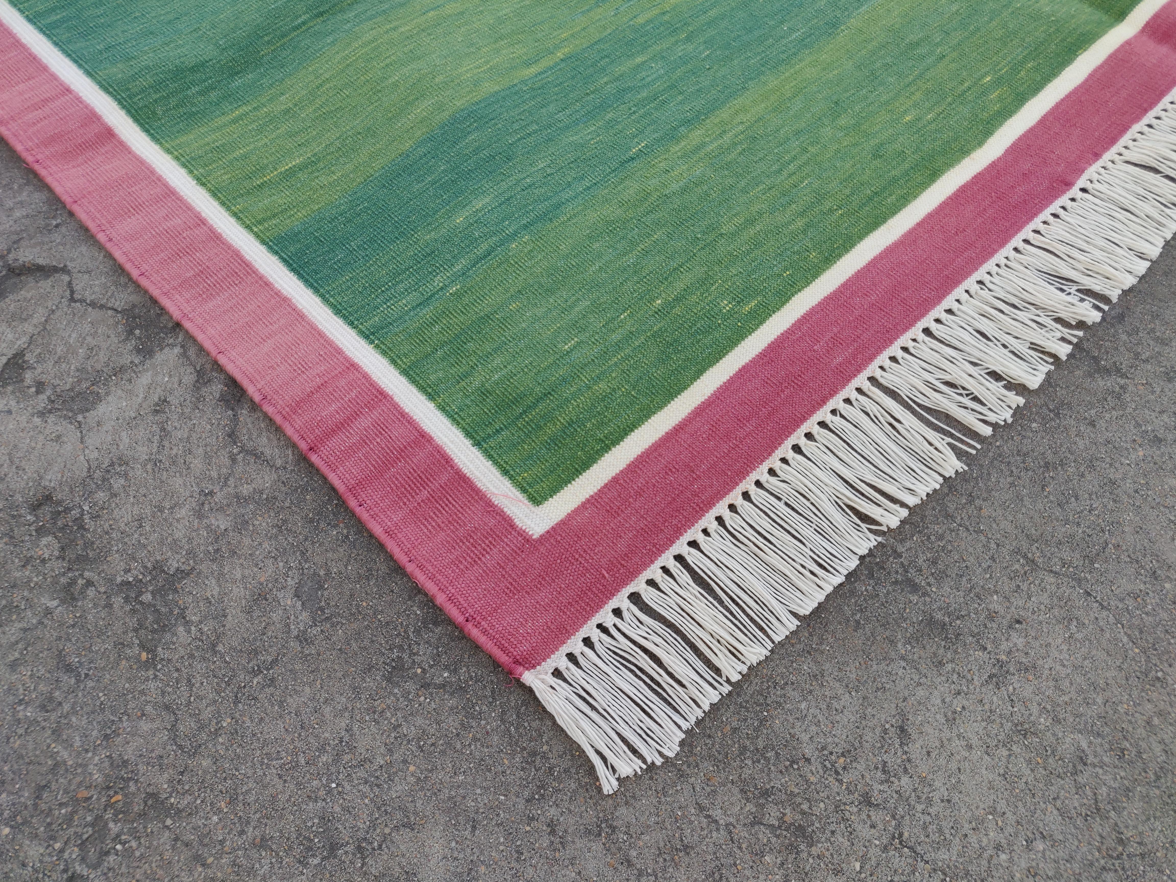 Cotton Vegetable Dyed Area Rug, Forest Green And Raspberry Pink Indian Rug-4'x6'
These special flat-weave dhurries are hand-woven with 15 ply 100% cotton yarn. Due to the special manufacturing techniques used to create our rugs, the size and color
