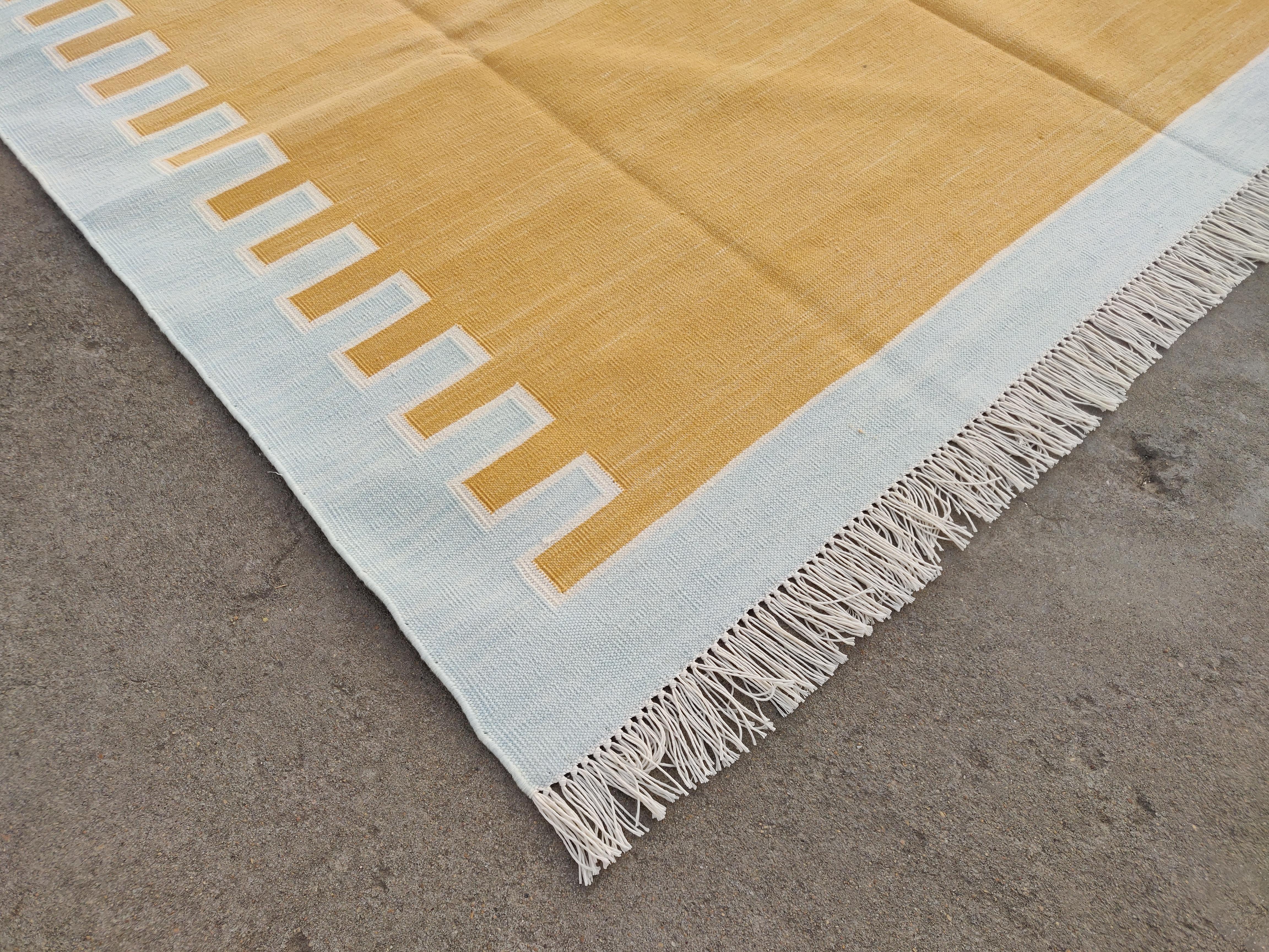 Cotton Vegetable Dyed Area Rug, Yellow, Cream And Light Blue Indian Zig Zag Striped Rug-6'x9'

These special flat-weave dhurries are hand-woven with 15 ply 100% cotton yarn. Due to the special manufacturing techniques used to create our rugs, the
