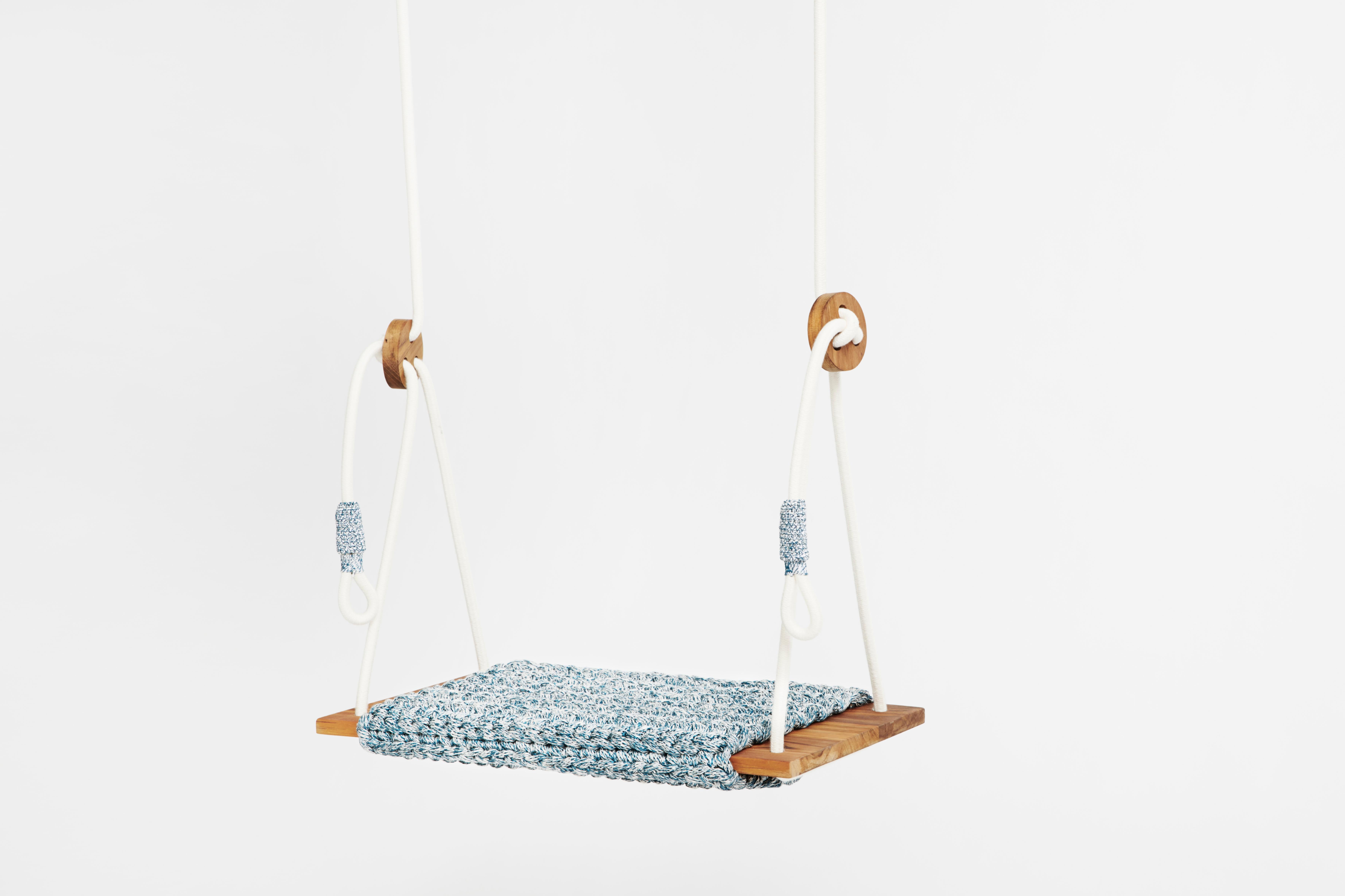 The iota rug swing, inspired by tracking in the desert and the North African culture, takes the user to a wild, natural, fantastic place. The swing showcases our special knitted hand work. It contains a knitted rug covering a wooden slag, which is