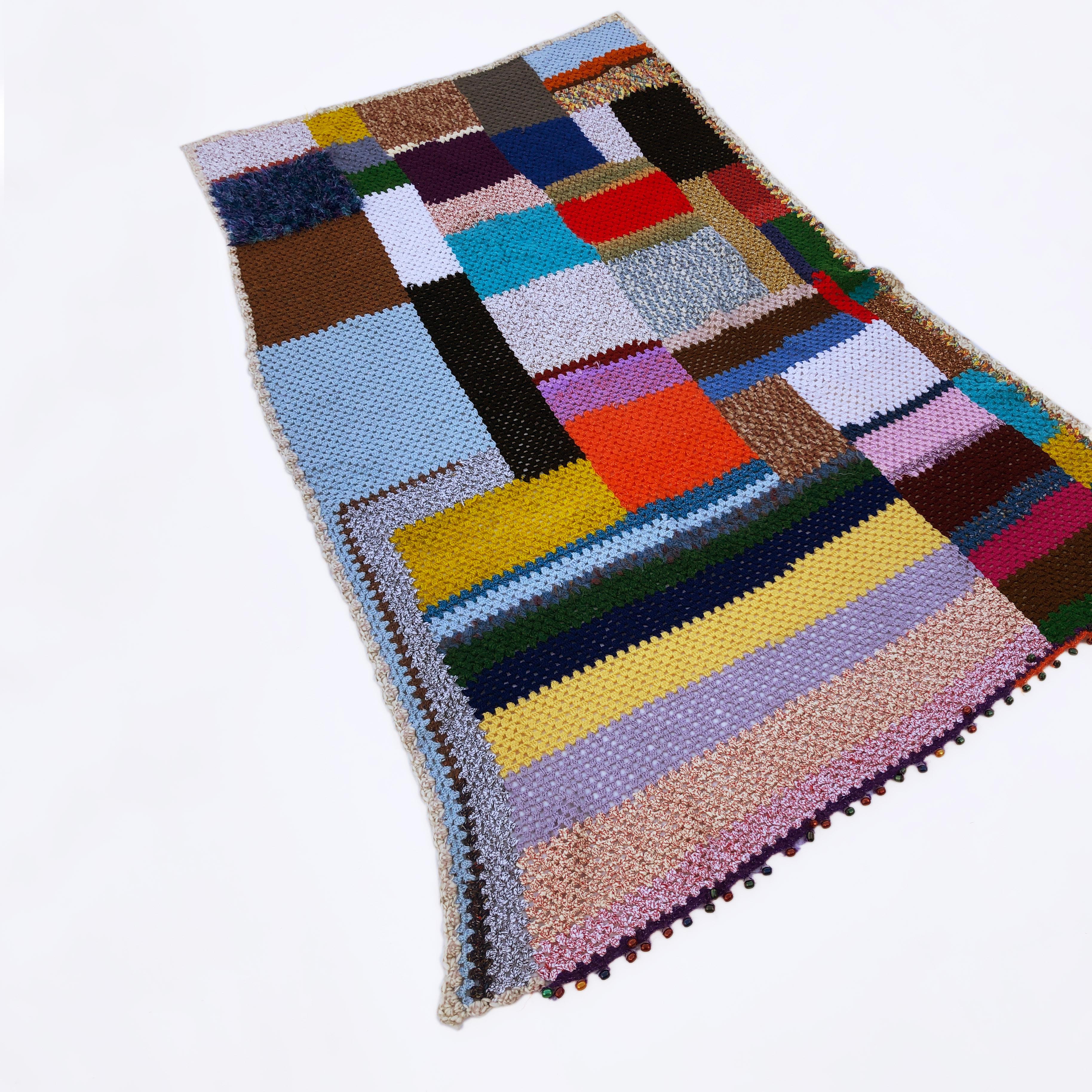 This throw is not just a fantastic piece of folk art but a labour of love. It is a handmade crochet patchwork blanket in mixed quality, colours and weight yarns in a variety of shapes and sizes that compose a beautiful cosy organic shape throw. From