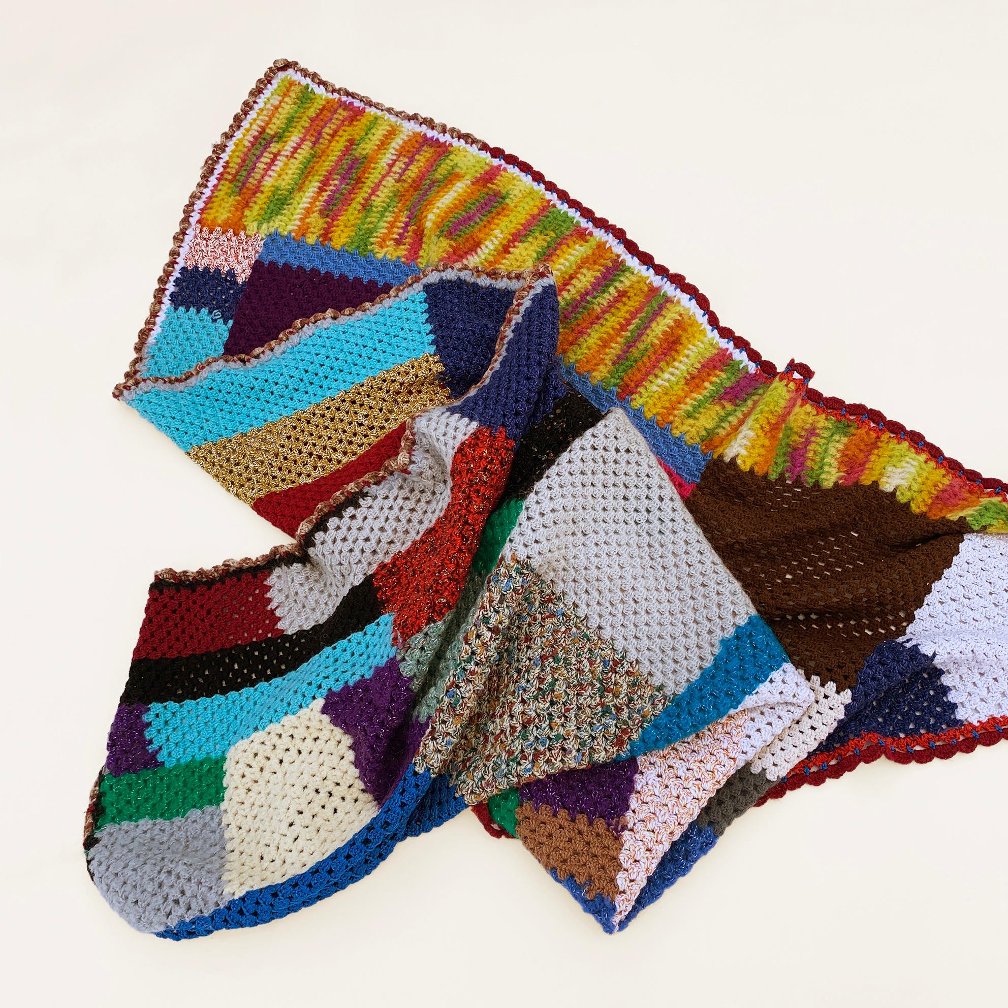 This throw is not just a fantastic piece of folk art but a labour of love. It is a handmade crochet patchwork blanket in mixed quality, colours and weight yarns in a variety of shapes and sizes that compose a beautiful cosy organic shape throw. You