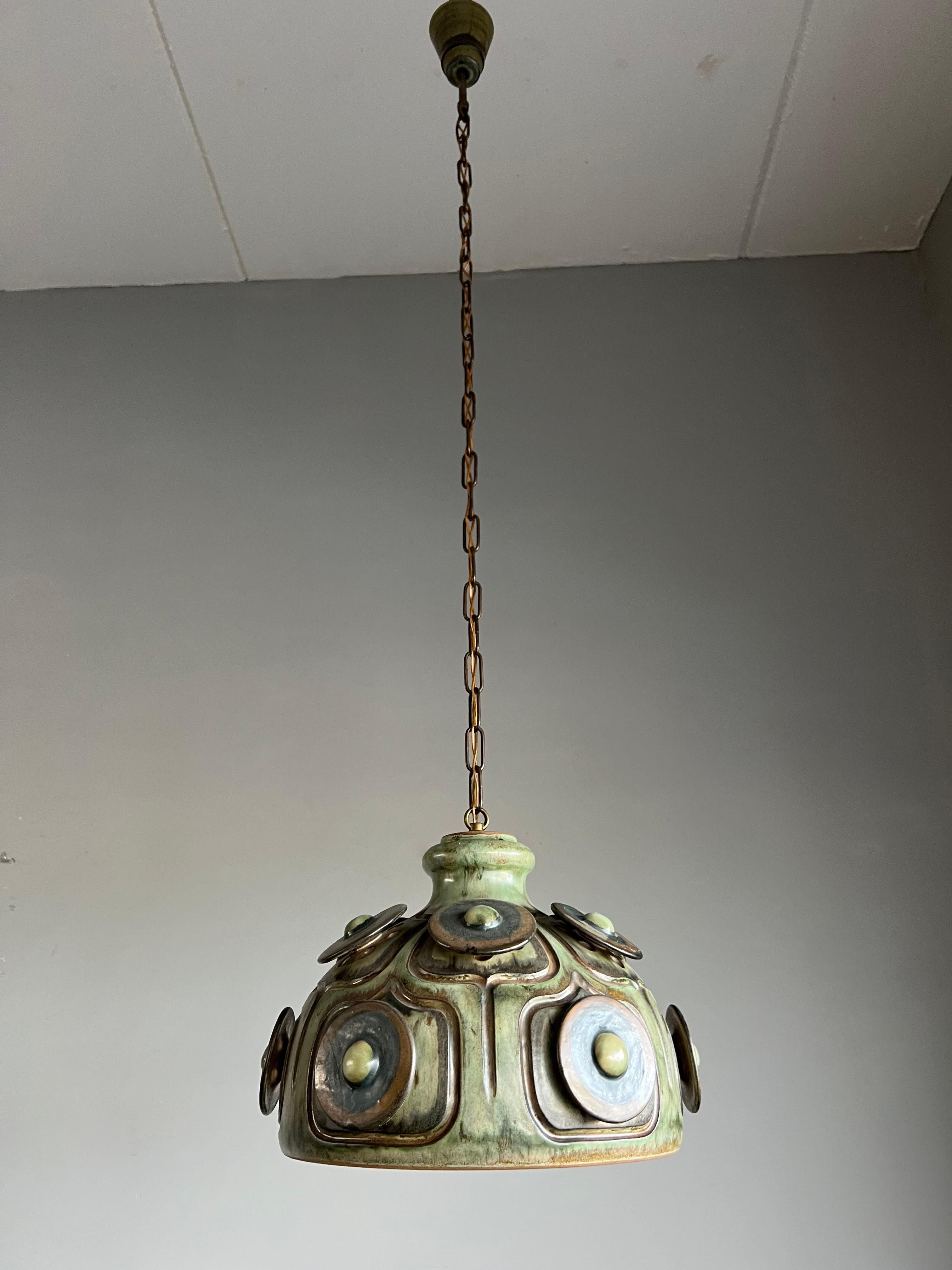 Beautiful green color and good size Danish hand-crafted fixture.

If you are looking for a stylish design, light to grace your home then this handmade specimen from the 1970s could be coming your way soon. With lighting as one of our specialities we