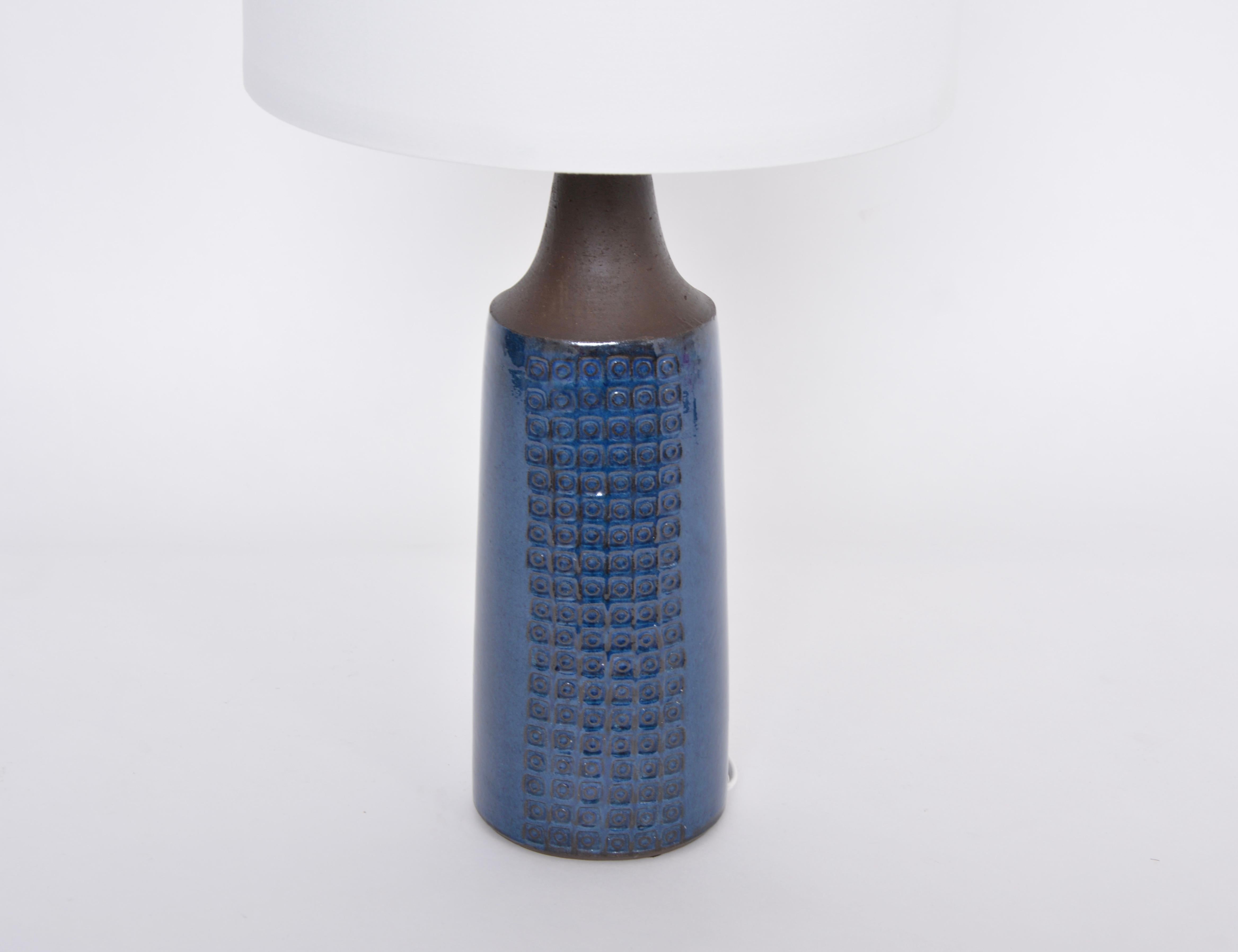 Handmade Danish Mid-Century Modern Ceramic table lamp by Nysted Keramik
This tall table lamp was manufactured in the small Danish city of Nysted in the 1970s. The lamp's base is made of stoneware and was glazed with beautiful deep blue colored