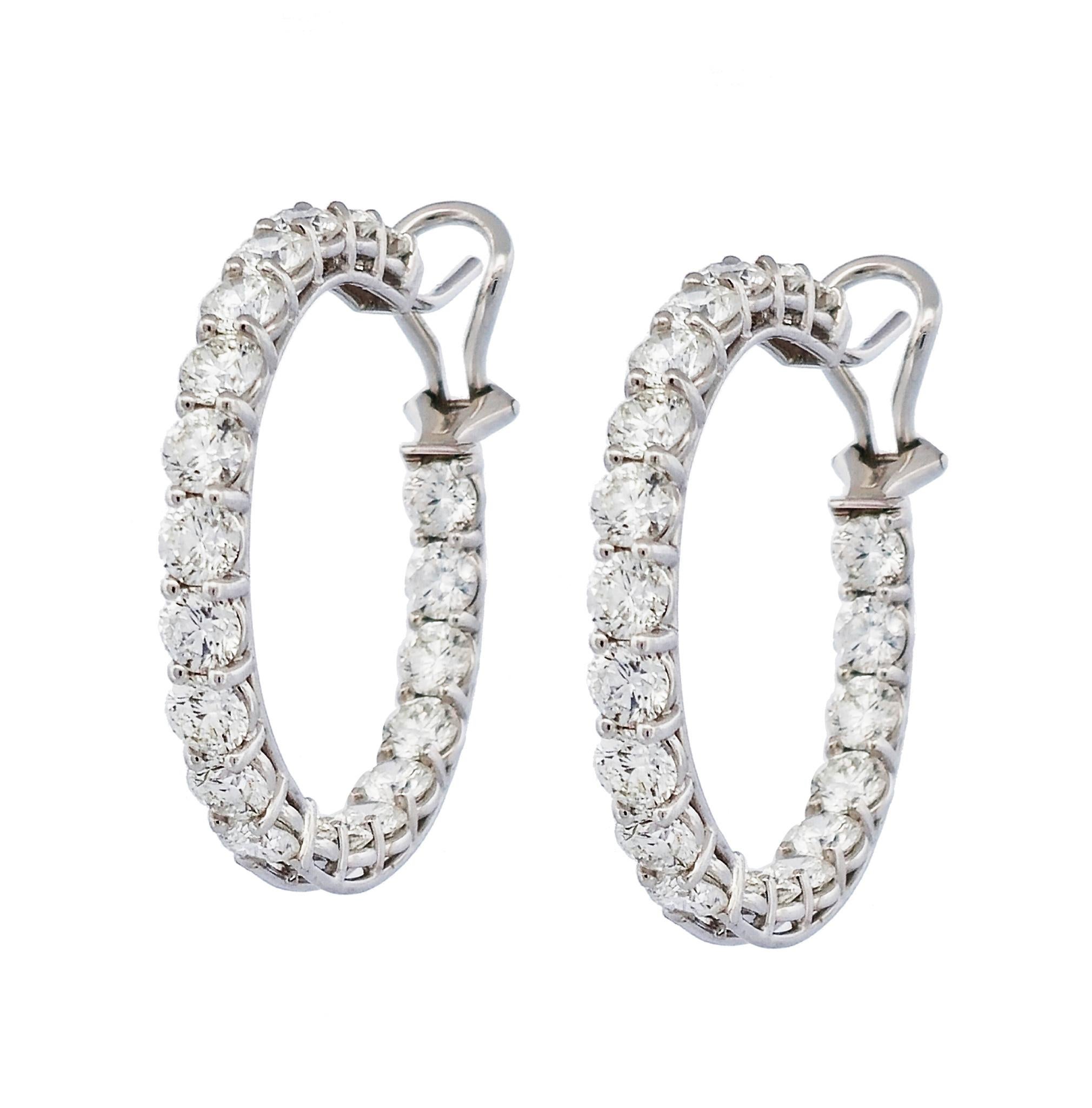 Luxurious Diamond Hoop Earrings from the Handmade H&H Collection are a stunning addition to any wardrobe. Crafted with 40 sparkling round brilliant cut diamonds, set in 18 karat white gold with a prong setting, these earrings will dazzle for years