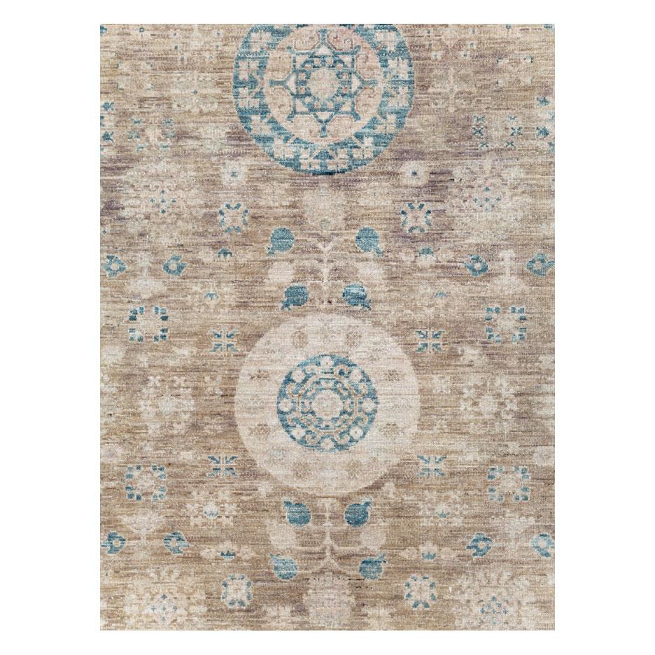 A new East Turkestan Khotan room size carpet handmade during the 21st century.

Measures: 10' 0