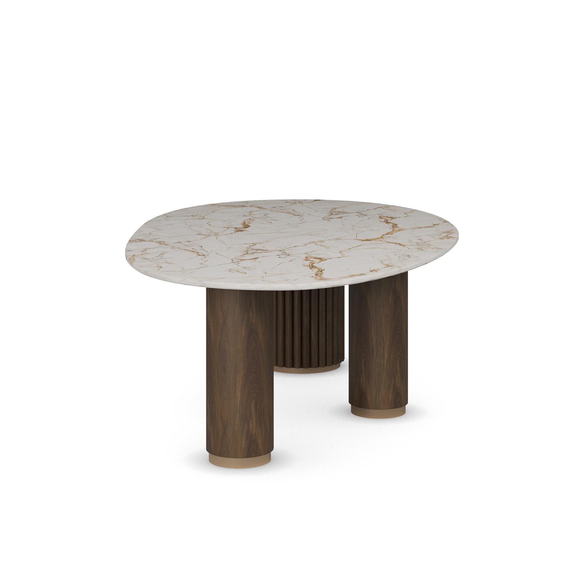 La table à manger Élodie de Nolita Harbour, un chef-d'œuvre de design moderne et d'artisanat exceptionnel. Cette table de salle à manger exquise est dotée d'un plateau ovale en marbre aux lignes épurées qui respire la sophistication et l'élégance