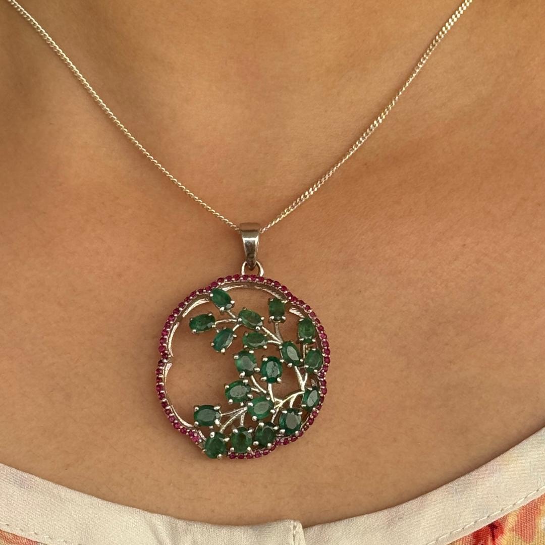 Handmade Emerald and Ruby Tree Of Life Pendant in sterling silver studded with round cut emerald, ruby. This stunning piece of jewelry instantly elevates a casual look or dressy outfit. 
Emerald, Ruby Gemstone enhances the intellectual capacity of