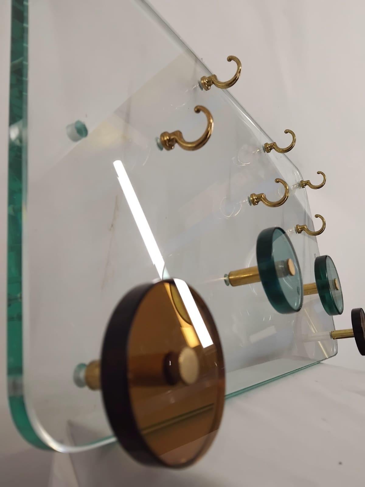Handmade Entryway Wall Mounted Coat Rack with Key Organizer on Crystal Glass Pannel, Italy 1970s
Unusual materials used for execution of a  coat rack ( Glass, Murano glass, crystal glass )