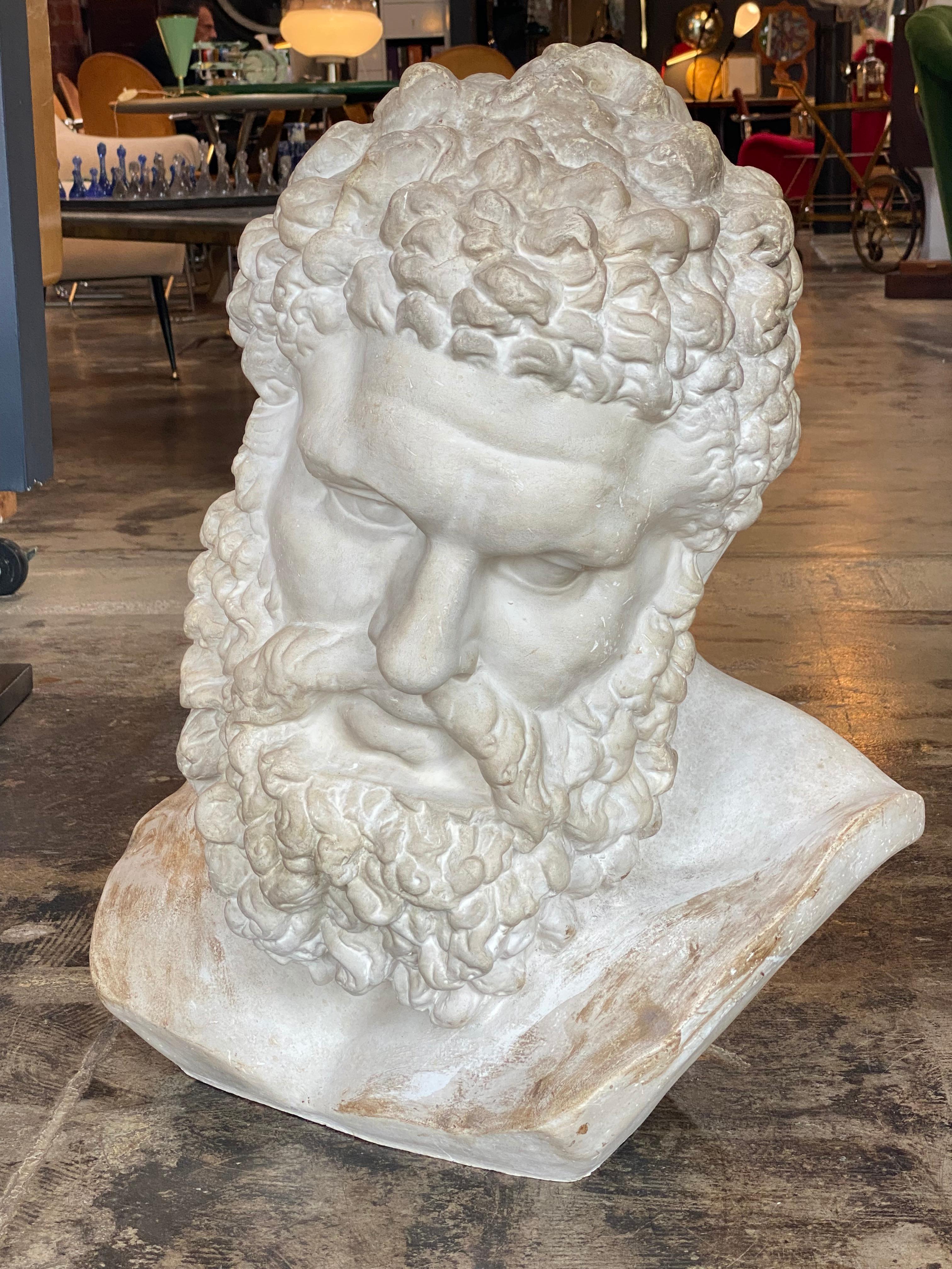 Handmade Ercole Farnese's sculpture made in plaster.
The Farnese Hercules is an ancient statue of Hercules, probably an enlarged copy made in the early third century AD and signed by Glykon, who is otherwise unknown; the name is Greek but he may