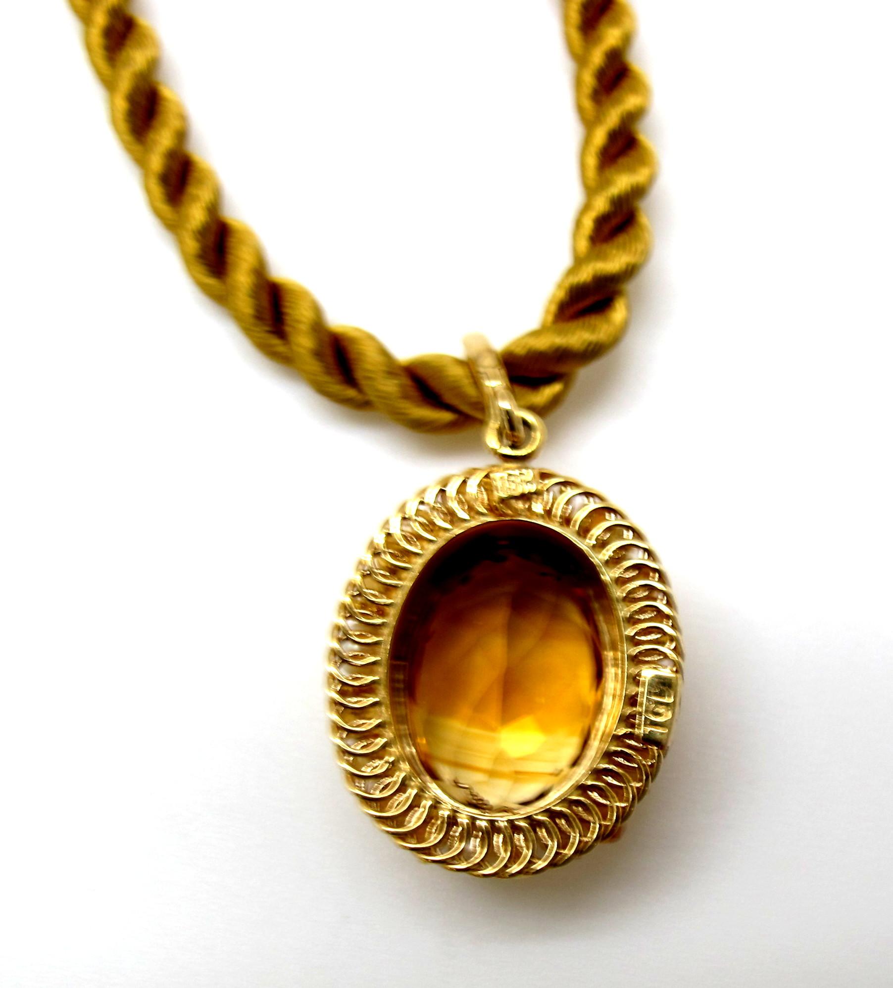 This delicate citrine pendant is entirely handmade of delicate 18 karat yellow gold wire using the lost art of filigree. It was made by one of our Master Jewelers in Los Angeles who has retired after a lifetime of devotion to his intricate art. The