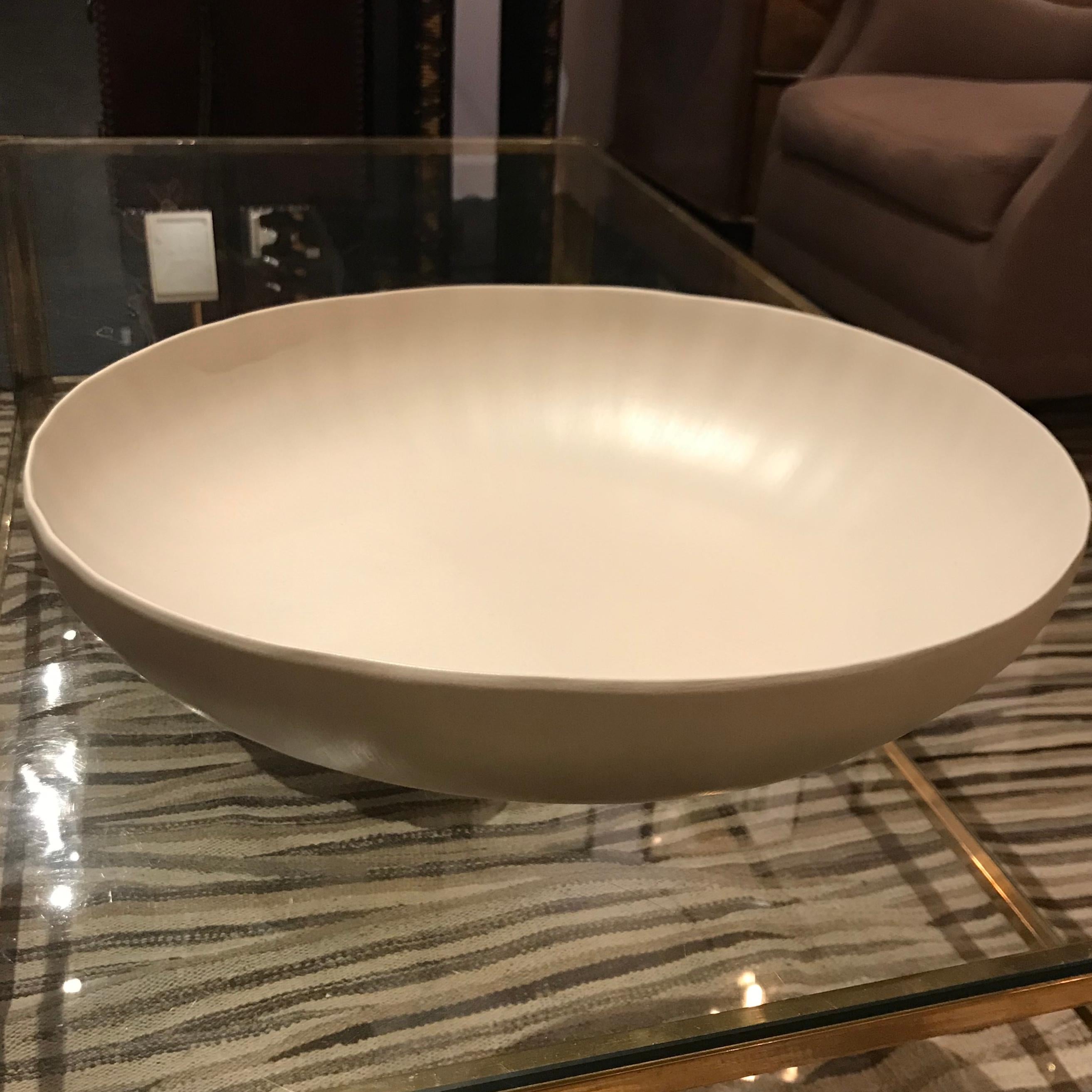 Handmade in Italy, from a collection of bowls and platters, each is unique in its organic shape and color.
This fine ceramic small (16