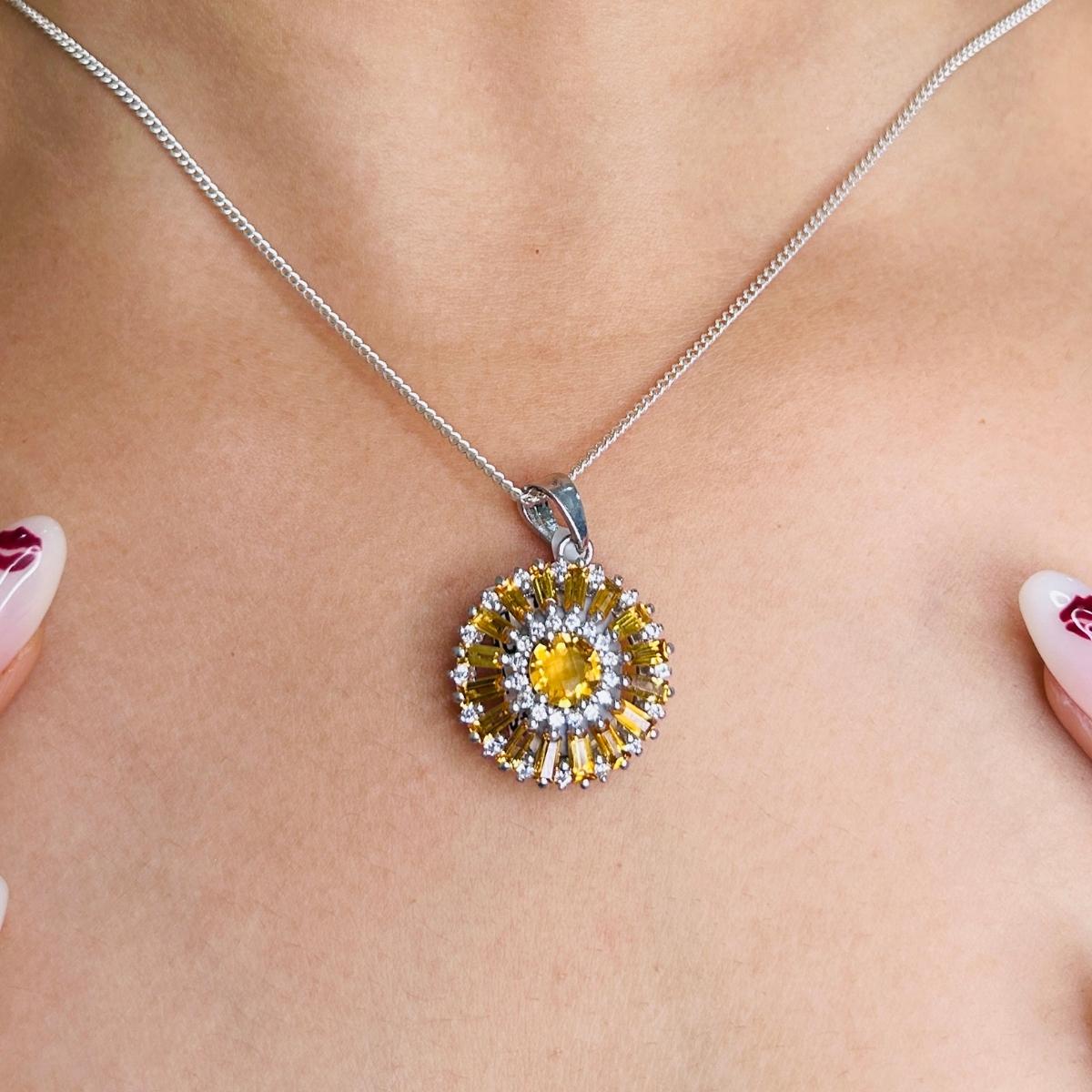 Handmade Citrine Gem Stone Sunflower Round Sterling Silver Pendant in sterling silver studded with round cut citrine. This stunning piece of jewelry instantly elevates a casual look or dressy outfit.
Citrine enhances the intellectual capacity of the