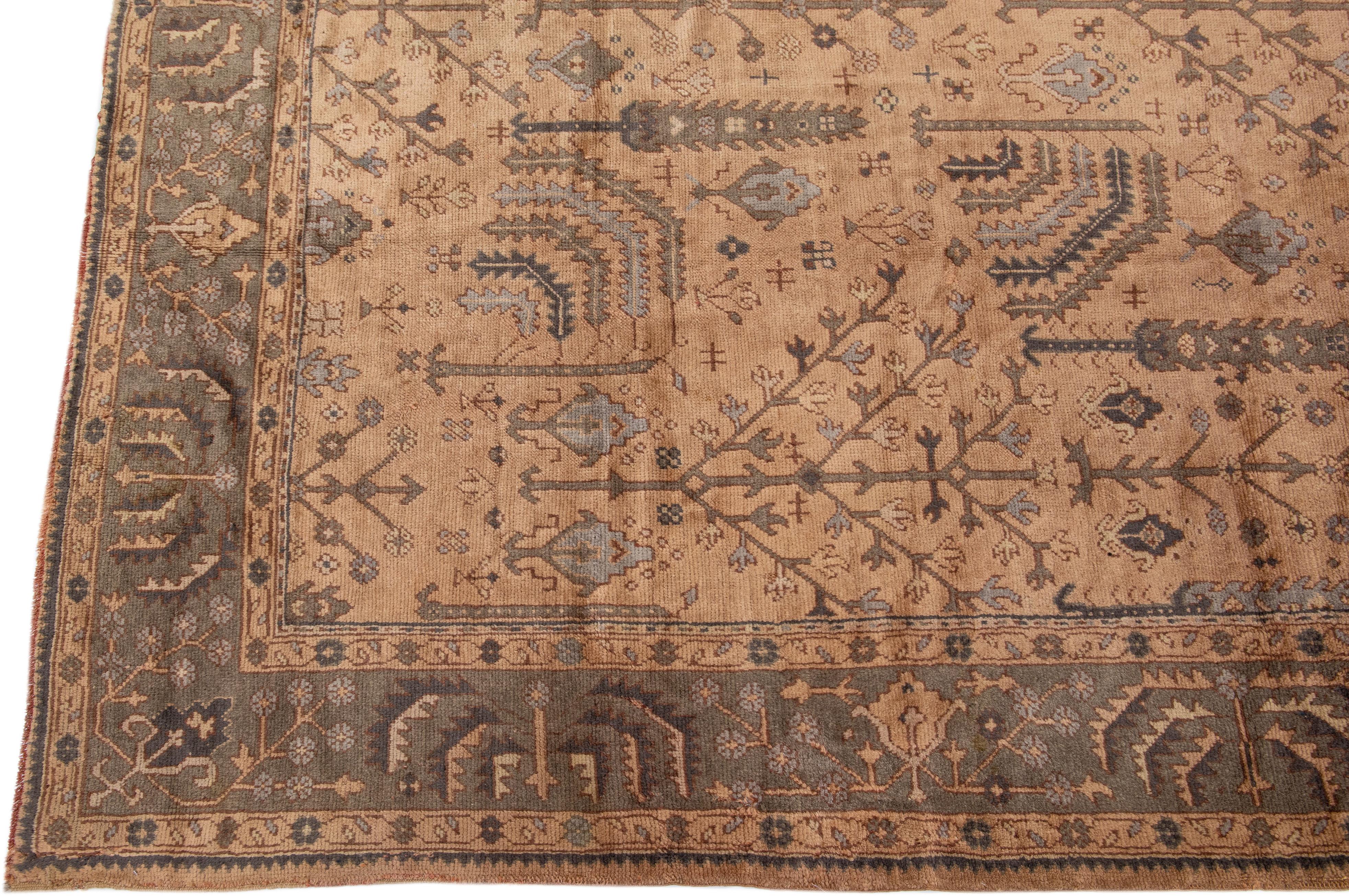 Indian Handmade Floral Antique Turkish Oushak Oversize Wool Rug with Allover Tan Field For Sale