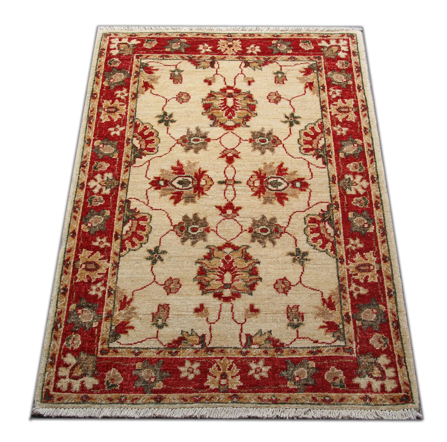 This rug is a Ziegler rug made on our looms by our master weavers in Afghanistan, Sultanabad. Featuring meandering floral patterns in colors of red and beige. The large-scale design makes Sultanabad designs regarded as the most appealing to European